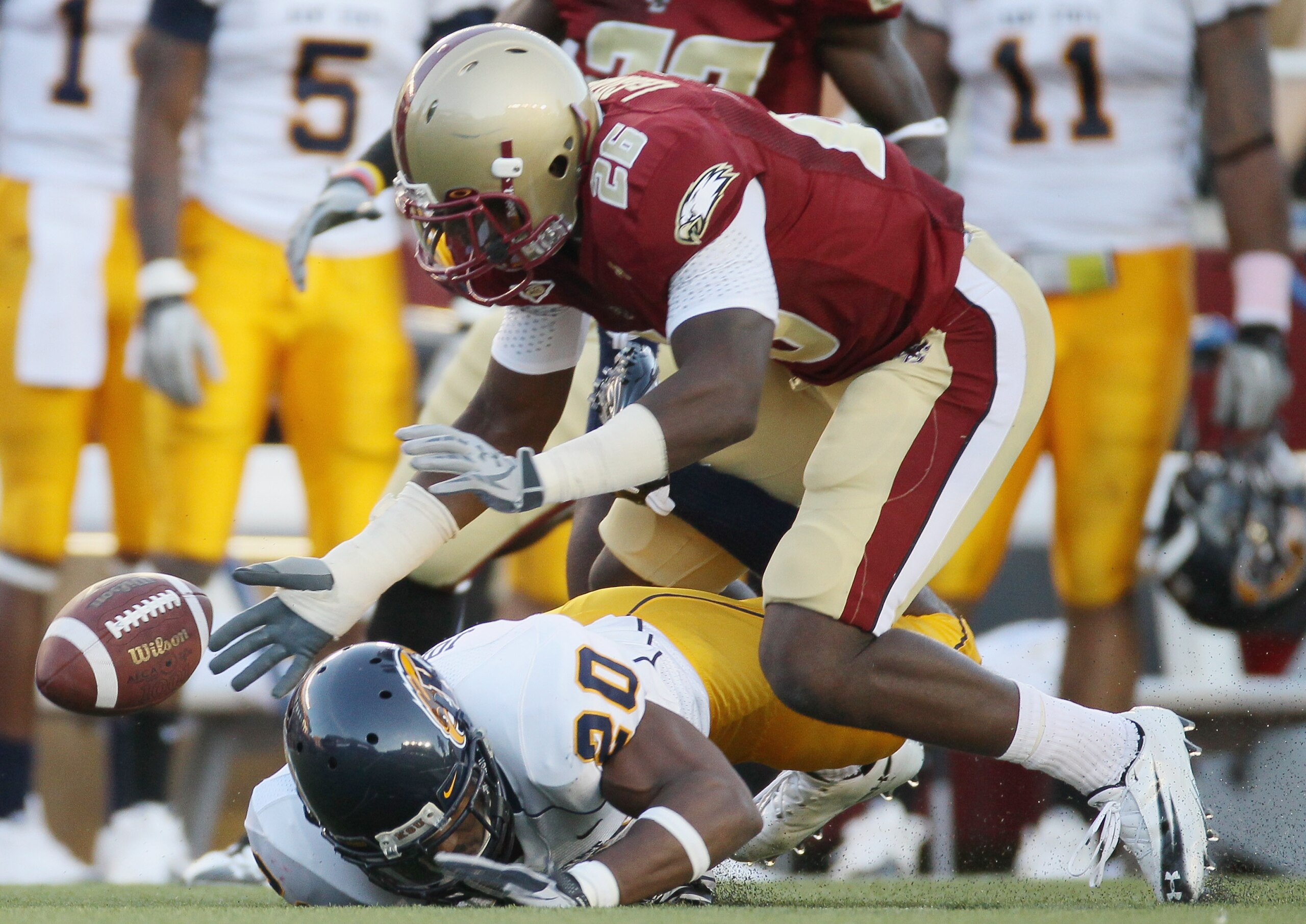 CHESTNUT HILL, MA - SEPTEMBER 11:  Dominick LeGrande #26 of the Boston College Eagles and Will Johnson #20 of the Kent State Golden Flashes chase after the fumble on September 11, 2010 at Alumni Stadium in Chestnut Hill, Massachusetts. Boston College defe