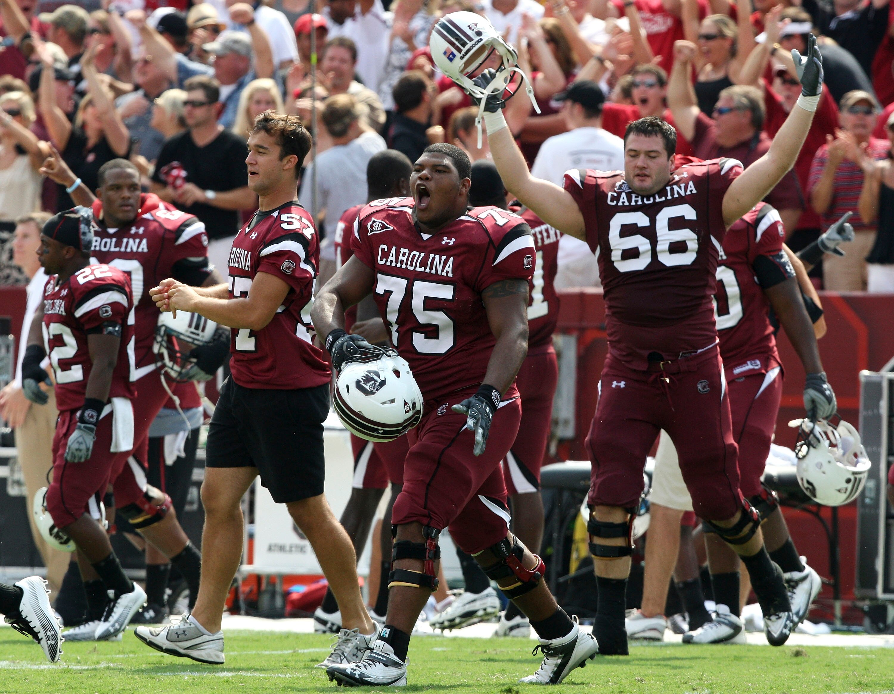 COLUMBIA, SC - SEPTEMBER 11: Members of the South Carolina Gamecocks team, including guard Steven Singleton #75 and tacklet Hutch Eckerson #66, run on the field after the game against the Georgia Bulldogs at Williams-Brice Stadium on September 11, 2010 in