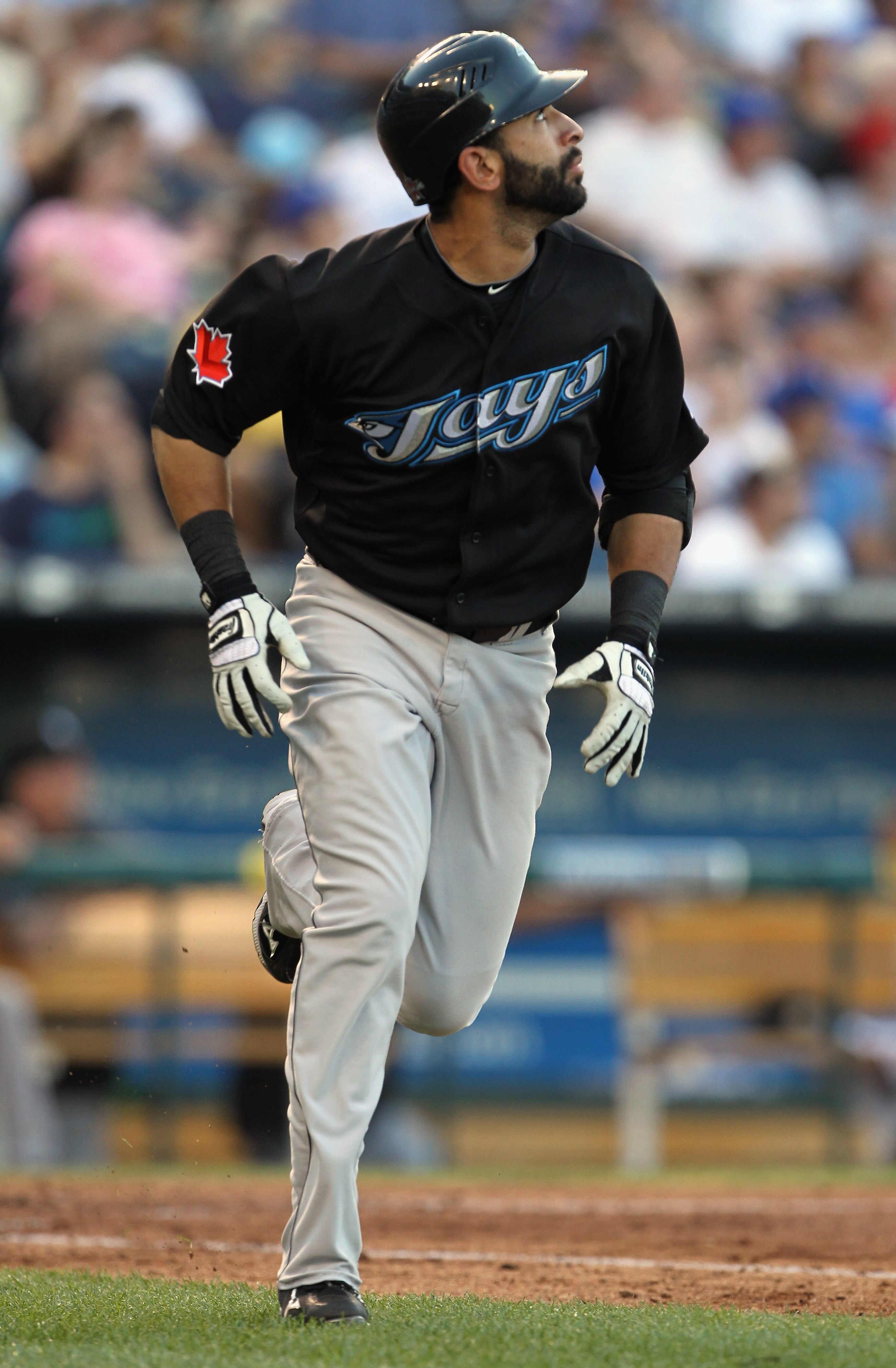 KANSAS CITY, MO - JULY 19:  Jose Bautista #19 of the Toronto Blue Jays watches a fly ball during the game against the Kansas City Royals on July 19, 2010 at Kauffman Stadium in Kansas City, Missouri.  (Photo by Jamie Squire/Getty Images)