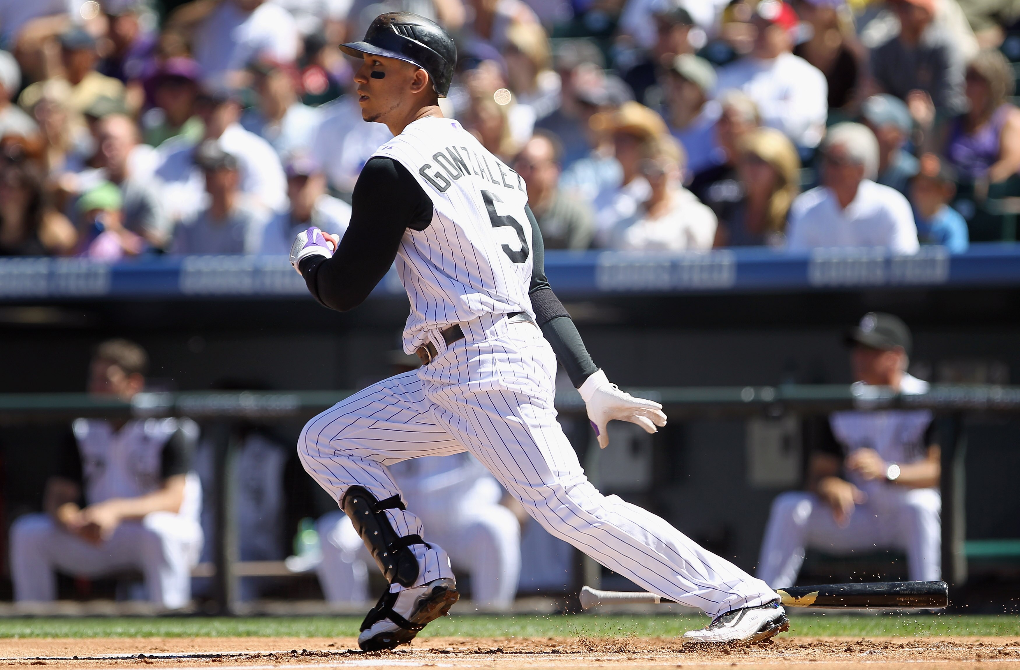 DENVER - SEPTEMBER 06:  Carlos Gonzalez #5 of the Colorado Rockies doubles in the first inning against the Cincinnati Reds at Coors Field on September 6, 2010 in Denver, Colorado. The Rockies defeated the Reds 10-5.  (Photo by Doug Pensinger/Getty Images)