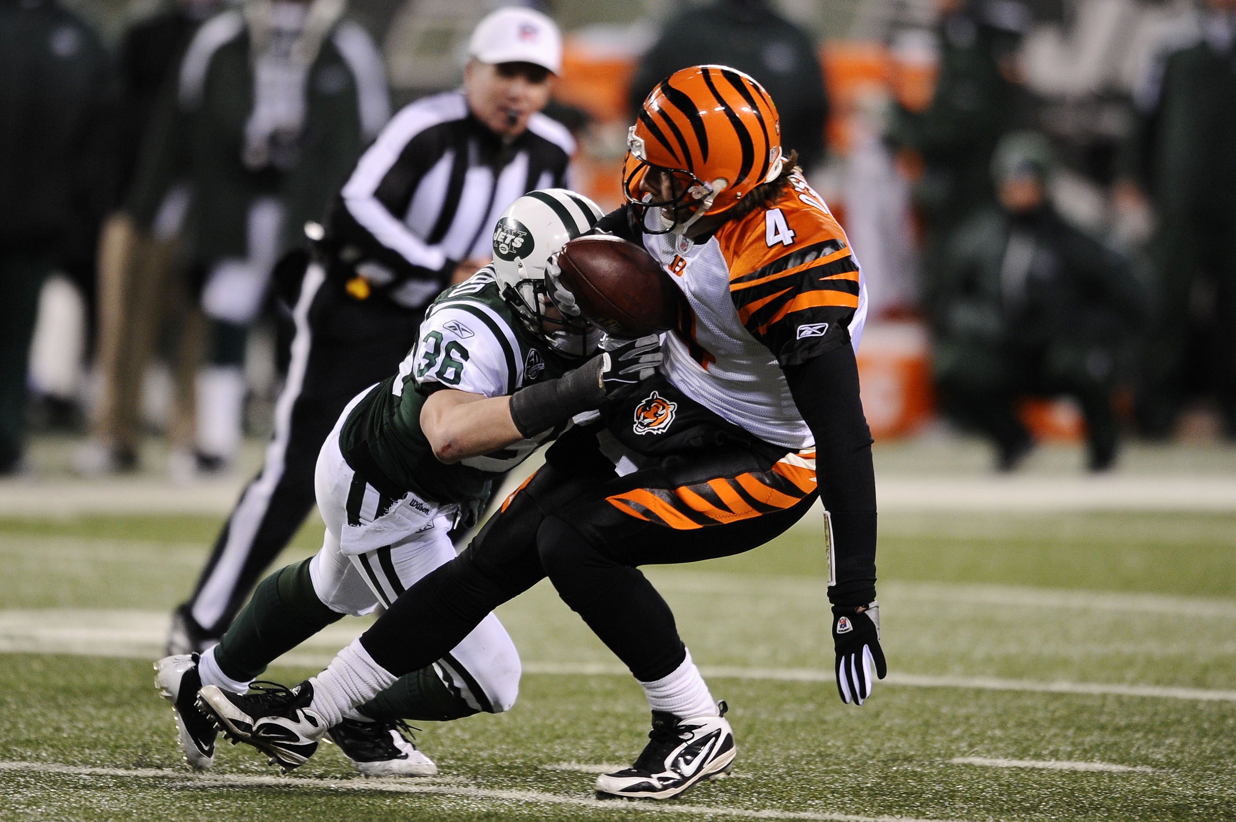 EAST RUTHERFORD, NJ - JANUARY 03:  Jim Leonhard #36 of the New York Jets tackles quarterback J.T. O'Sullivan #4 of the Cincinnati Bengals in the second half of the game at Giants Stadium on January 3, 2010 in East Rutherford, New Jersey.  The Jets defeate
