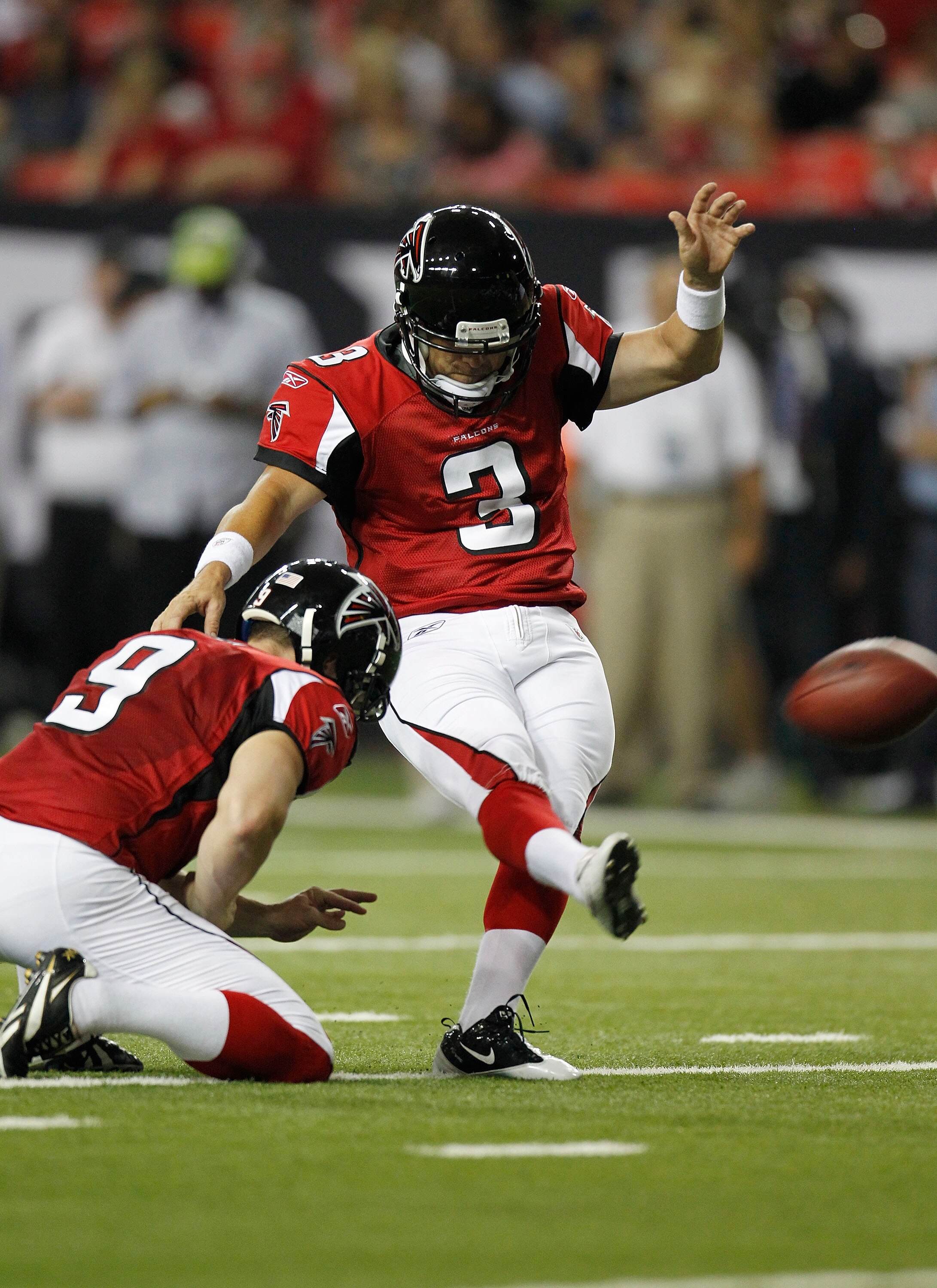 ATLANTA - AUGUST 19:  Kicker Matt Bryant #3 of the Atlanta Falcons kicks an extra point while punter Michael Koenen #9 holds during the preseason game against the New England Patriots at the Georgia Dome on August 19, 2010 in Atlanta, Georgia.  The Patrio