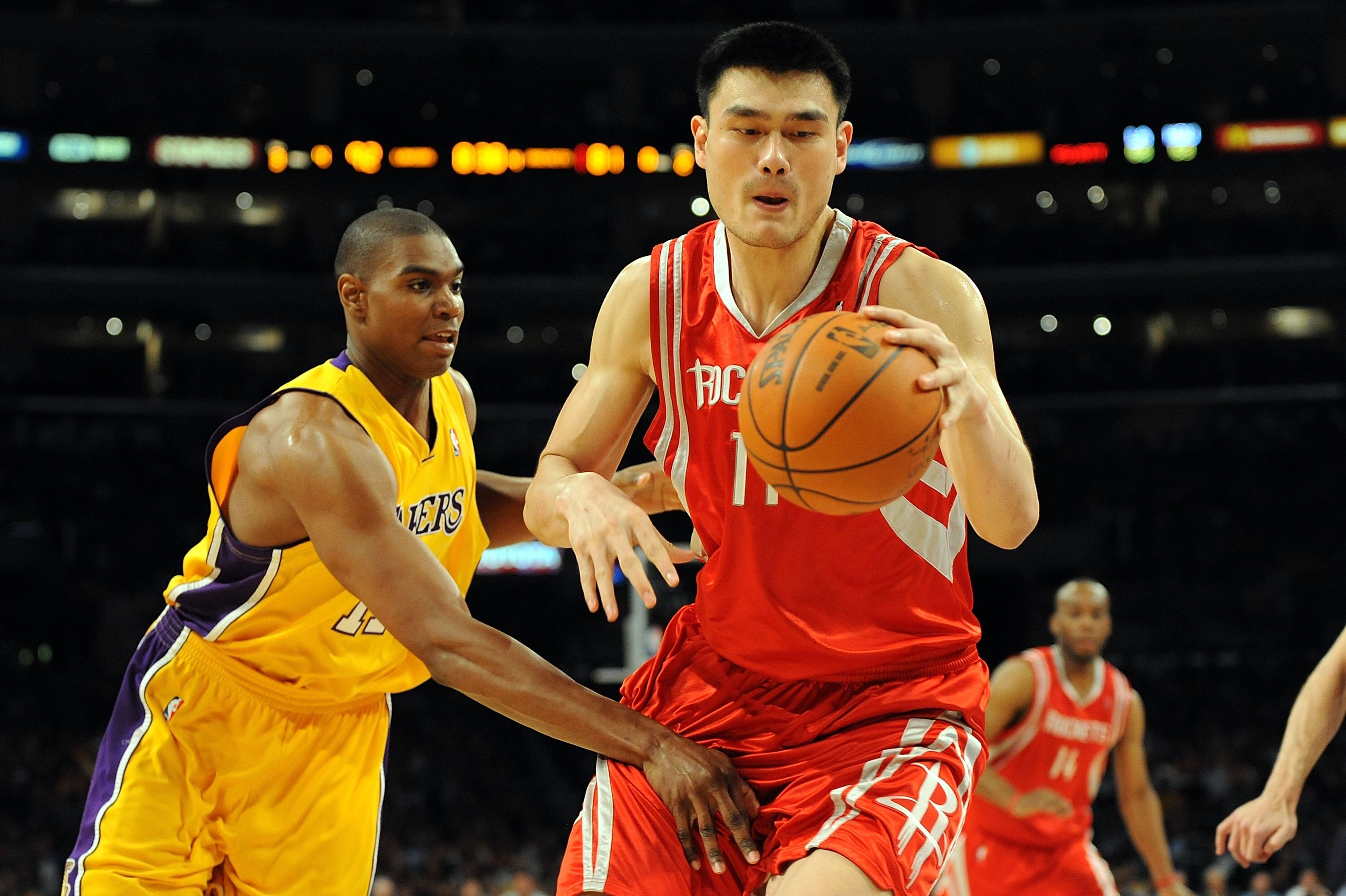 LOS ANGELES, CA - MAY 06:  Yao Ming #11 of the Houston Rockets moves the ball against Andrew Bynum #17 of the Los Angeles Lakers in Game Two of the Western Conference Semifinals during the 2009 NBA Playoffs at Staples Center on May 6, 2009 in Los Angeles,