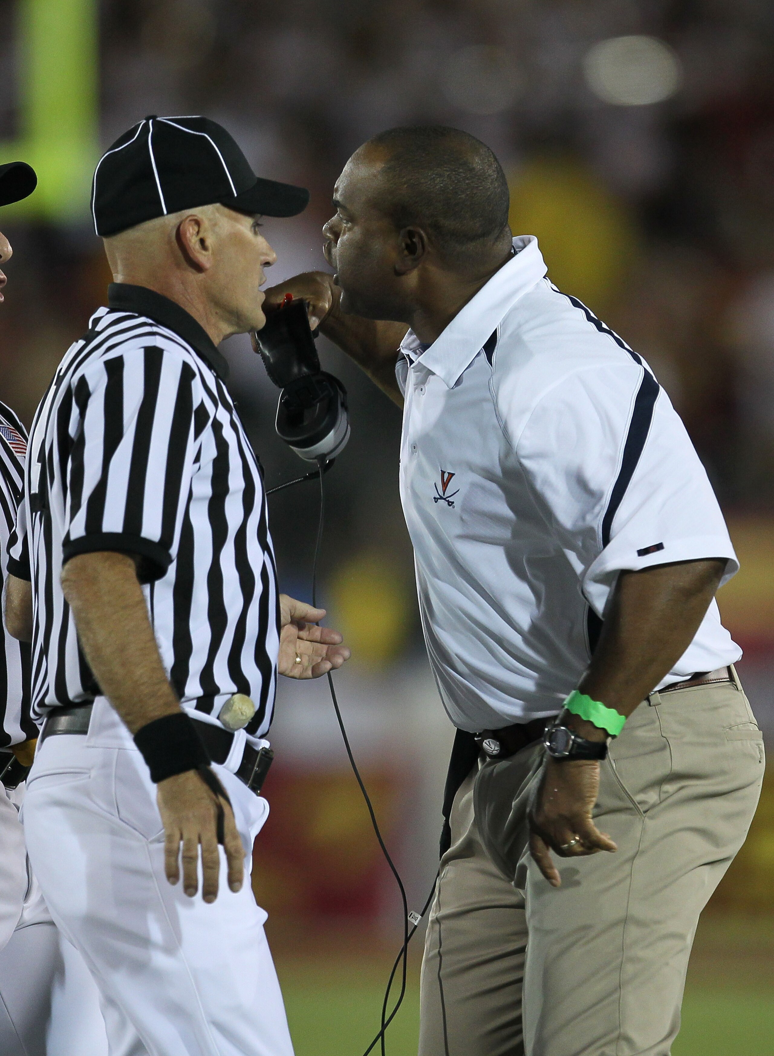LOS ANGELES, CA - SEPTEMBER 11:  Head coach Mike London of the Virginia Cavaliers complains to an official during the game against the USC Trojans at Los Angeles Memorial Coliseum on September 11, 2010 in Los Angeles, California. USC won 17-14.  (Photo by