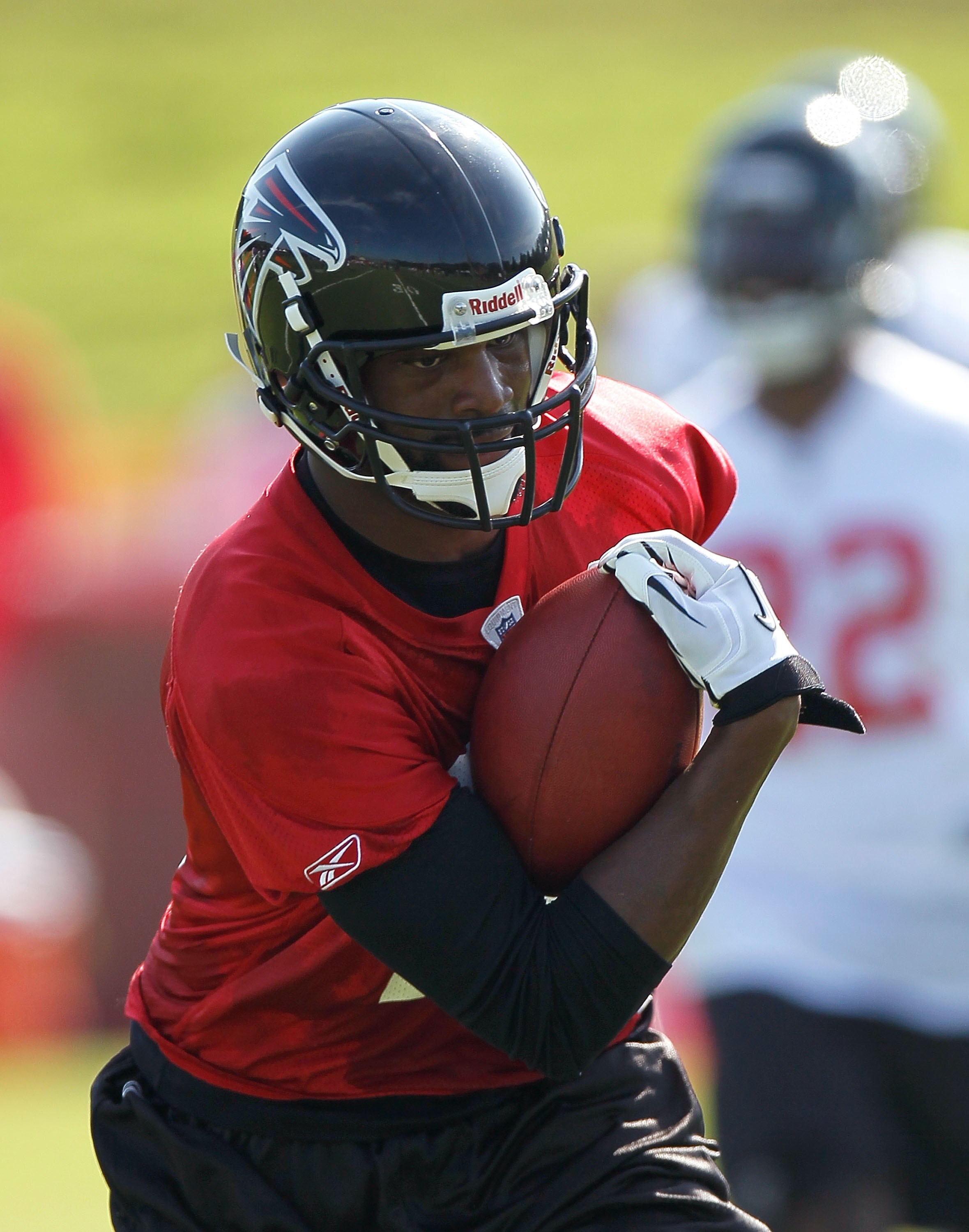 FLOWERY BRANCH, GA - JULY 30:  Michael Jenkins #12 of the Atlanta Falcons runs drills during opening day of training camp on July 30, 2010 at the Falcons Training Complex in Flowery Branch, Georgia.  (Photo by Kevin C. Cox/Getty Images)