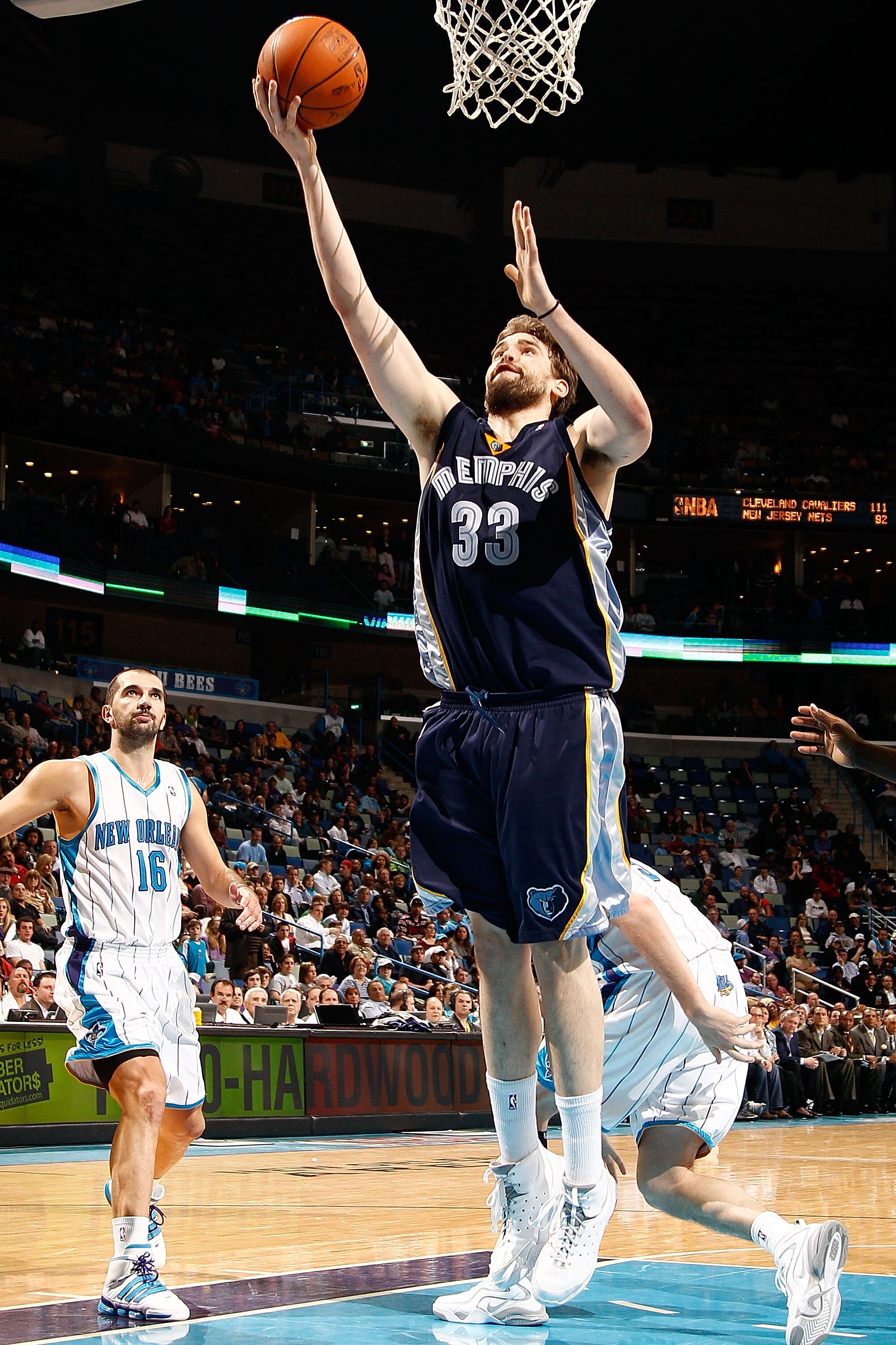 NEW ORLEANS - MARCH 03:  Marc Gasol #33of the Memphis Grizzlies shoots the ball around Peja Stojakovic #16 of the New Orleans Hornets at the New Orleans Arena on March 3, 2010 in New Orleans, Louisiana.  The Grizzlies defeated the Hornets 104-100.  NOTE T