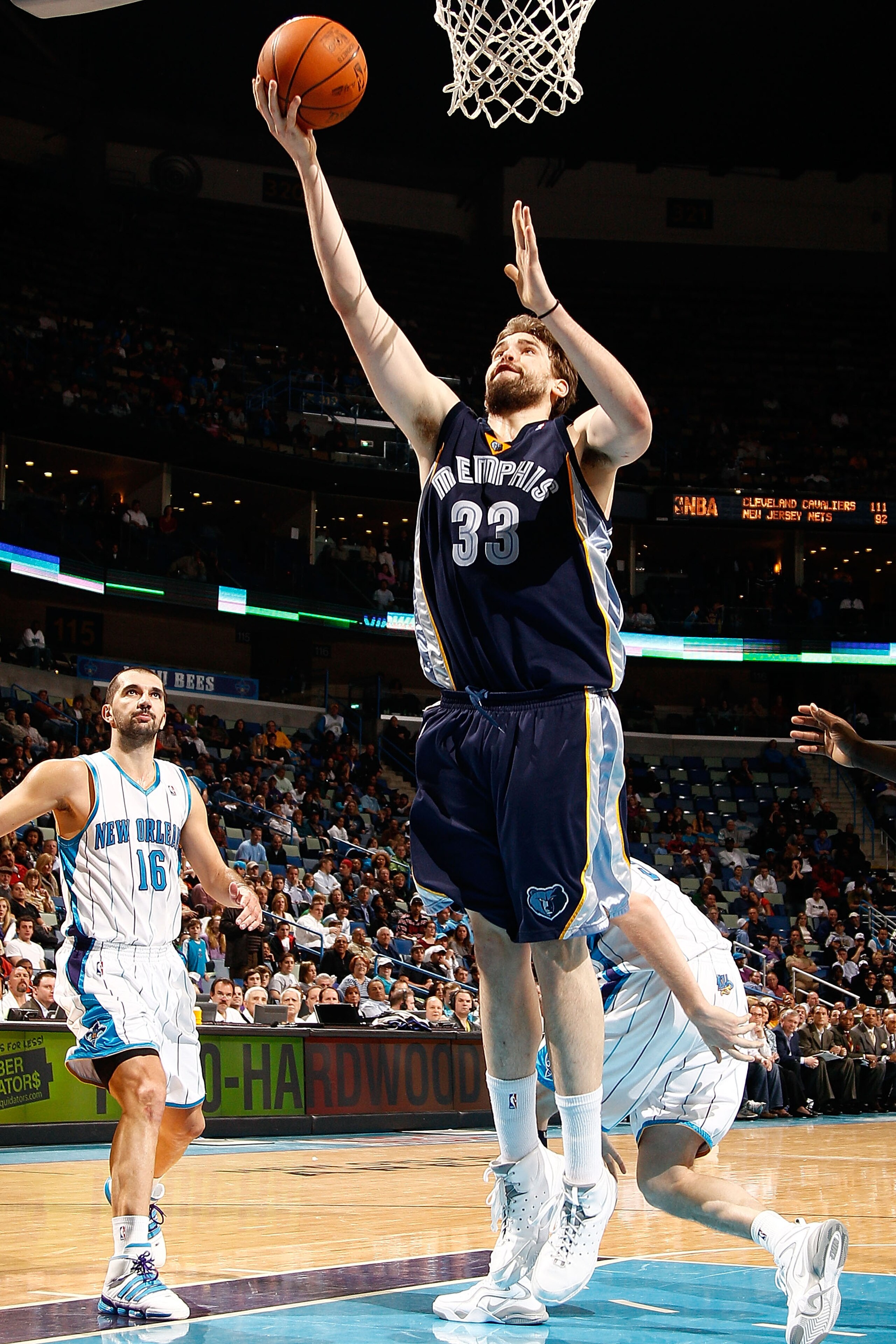 NEW ORLEANS - MARCH 03:  Marc Gasol #33of the Memphis Grizzlies shoots the ball around Peja Stojakovic #16 of the New Orleans Hornets at the New Orleans Arena on March 3, 2010 in New Orleans, Louisiana.  The Grizzlies defeated the Hornets 104-100.  NOTE T