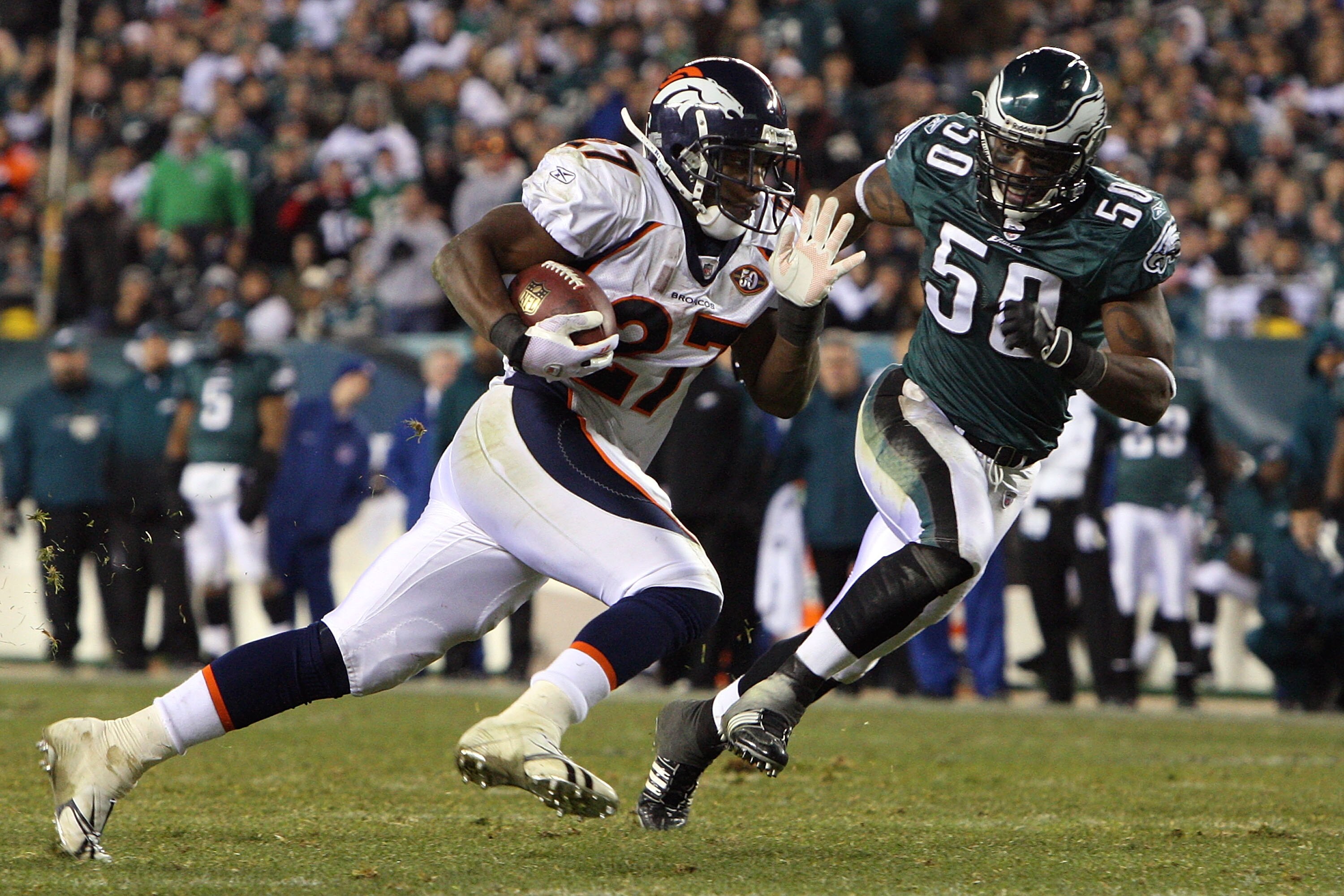 PHILADELPHIA - DECEMBER 27:  Knowshon Moreno #27 of the Denver Broncos runs the ball past Will Witherspoon #50 of the Philadelphia Eagles for a touchdown on December 27, 2009 at Lincoln Financial Field in Philadelphia, Pennsylvania. The Eagles defeated th