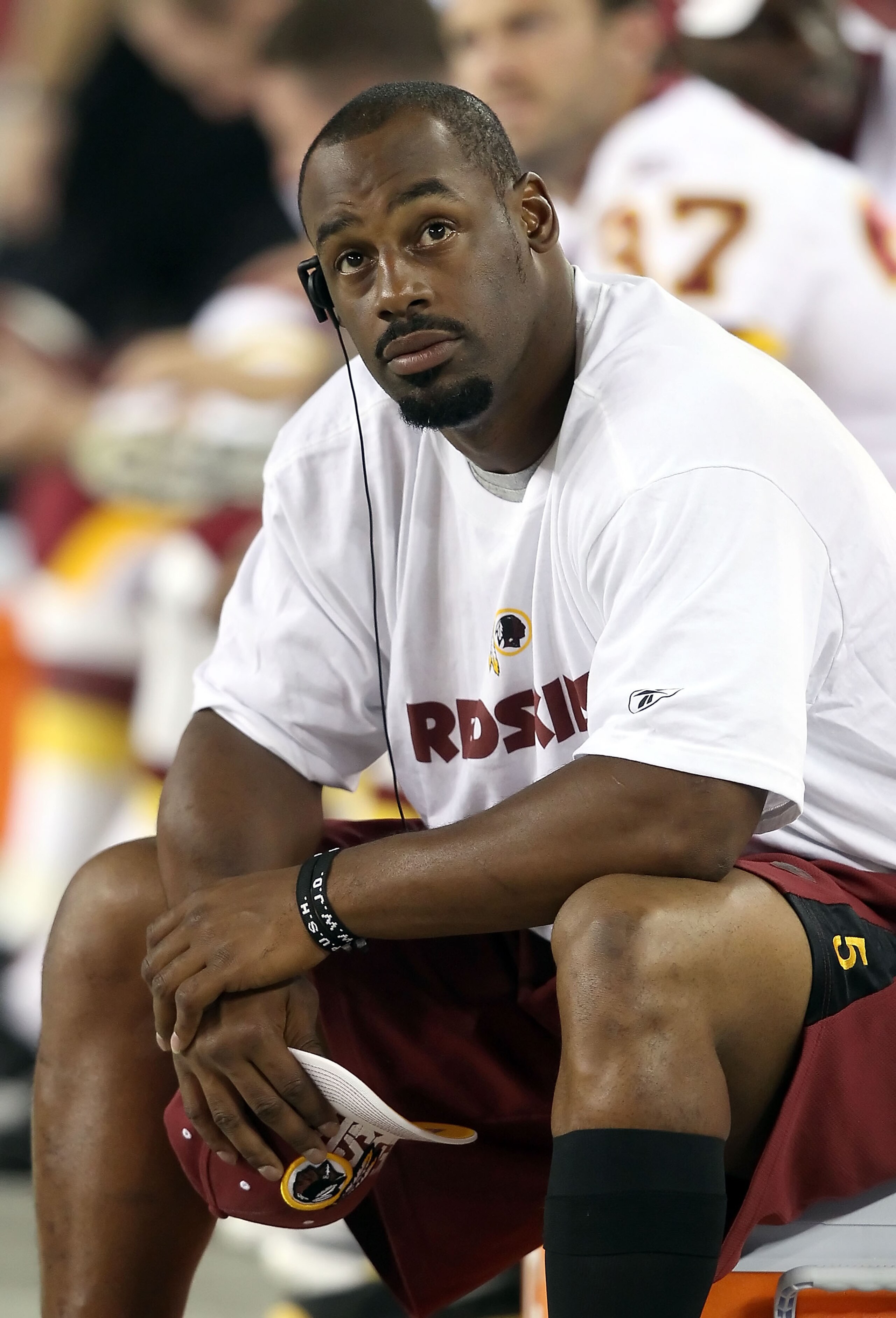 GLENDALE, AZ - SEPTEMBER 02:  Quarterback Donovan McNabb #5 of the Washington Redskins sits on the sidelines during preseason NFL game against the Arizona Cardinals at the University of Phoenix Stadium on September 2, 2010 in Glendale, Arizona.  The Cardi
