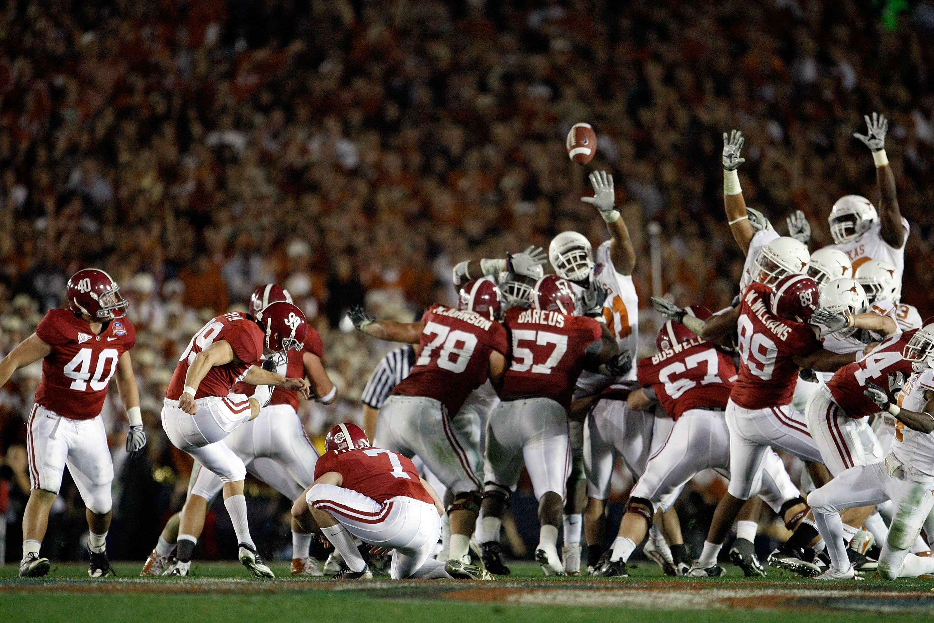 PASADENA, CA - JANUARY 07: Kicker Leigh Tiffin #99 of the Alabama Crimson Tide kicks a field goal against the Texas Longhorns in the Citi BCS National Championship game at the Rose Bowl on January 7, 2010 in Pasadena, California. (Photo by Jeff Gross/Ge PASADENA, CA - JANUARY 07: Kicker Leigh Tiffin #99 of the Alabama Crimson Tide kicks a field goal against the Texas Longhorns in the Citi BCS National Championship game at the Rose Bowl on January 7, 2010 in Pasadena, California. (Photo by Jeff Gross/Ge