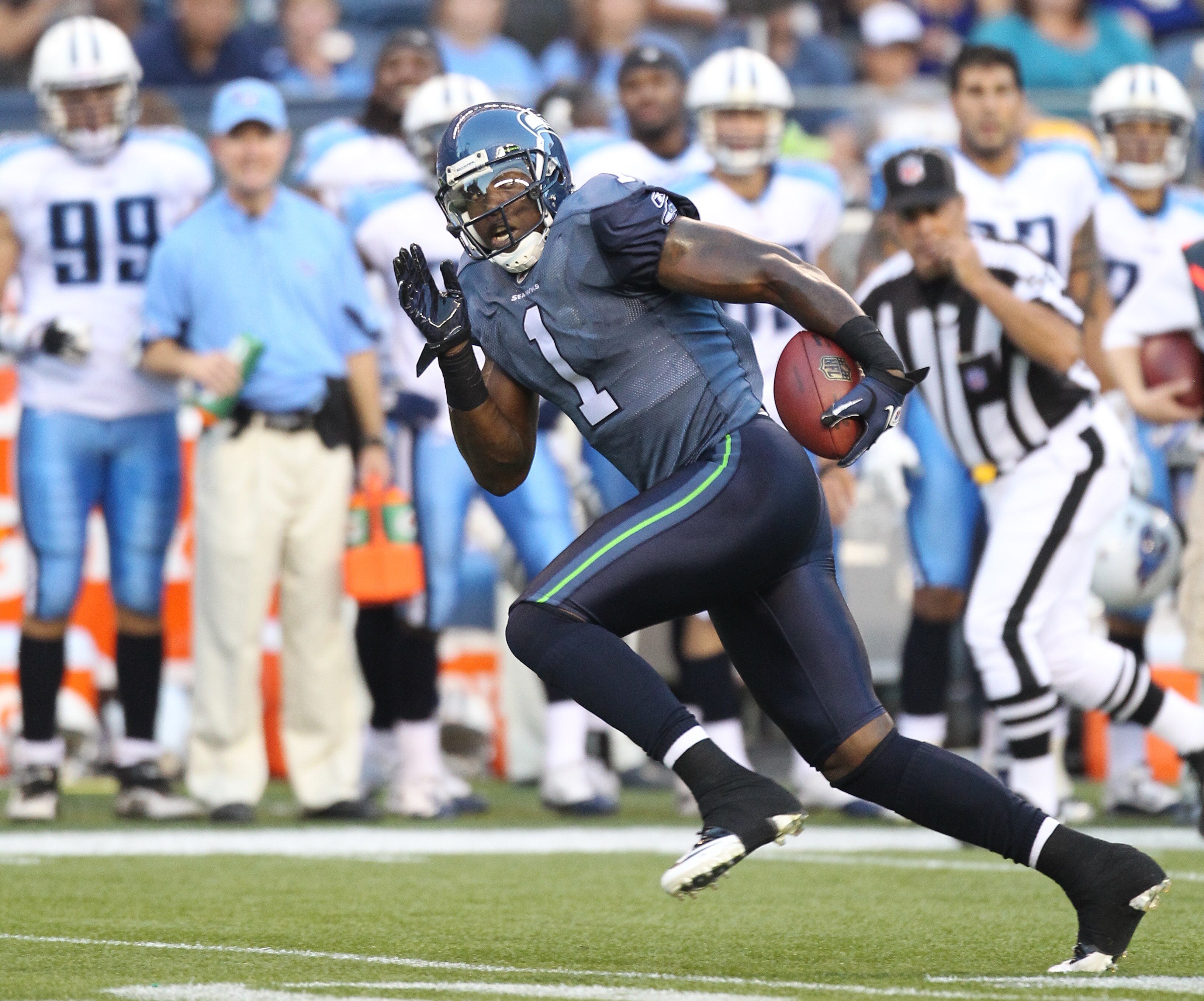 SEATTLE - AUGUST 14:  Wide receiver Mike Williams #1 of the Seattle Seahawks rushes for a touchdown pass play during the preseason game against the Tennessee Titans at Qwest Field on August 14, 2010 in Seattle, Washington. (Photo by Otto Greule Jr/Getty I