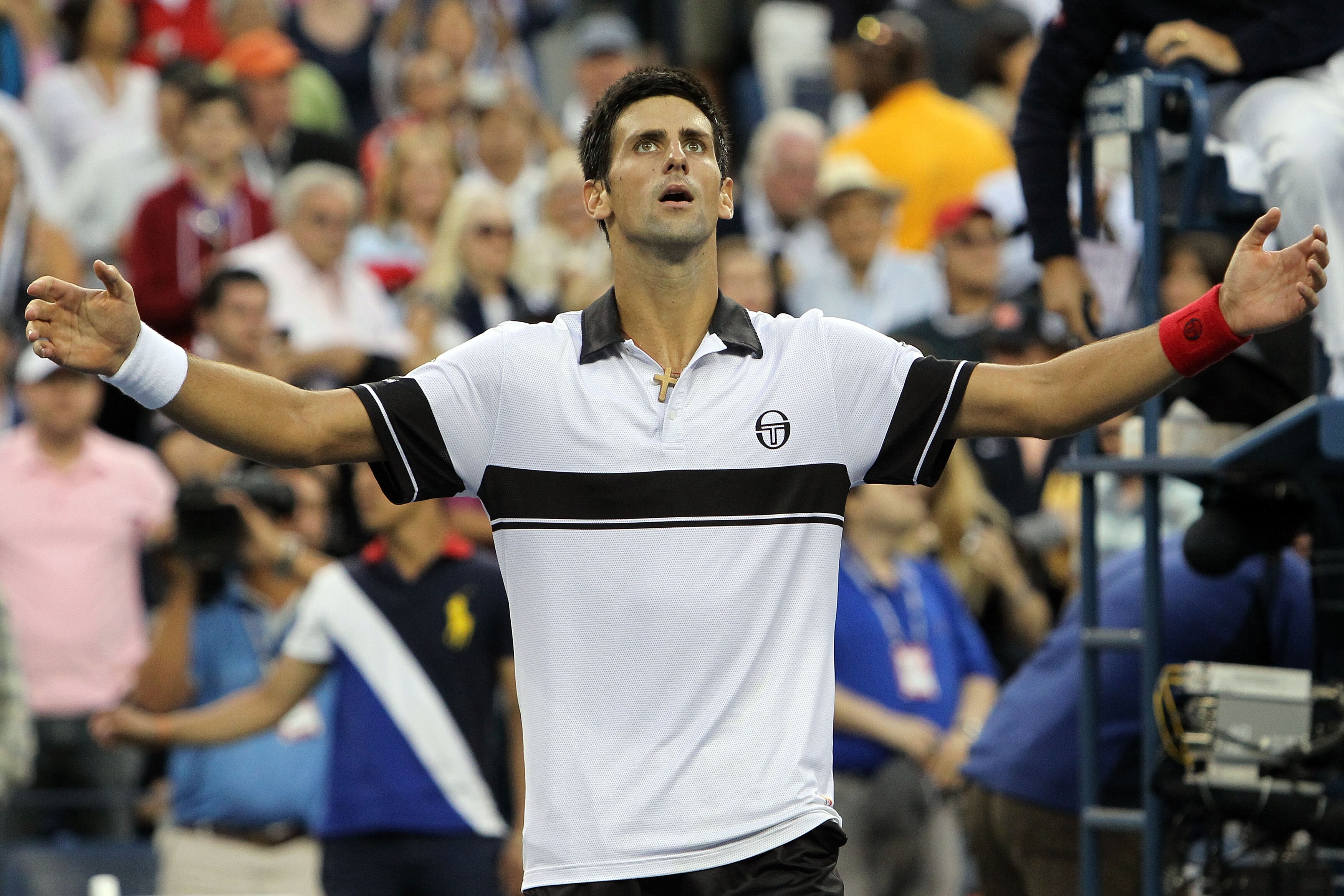 NEW YORK - SEPTEMBER 11: Novak Djokovic of Serbia celebrates defeating Roger Federer of Switzerland to win his men's singles semifinal match on day thirteen of the 2010 U.S. Open at the USTA Billie Jean King National Tennis Center on September 11, 2010 i NEW YORK - SEPTEMBER 11: Novak Djokovic of Serbia celebrates defeating Roger Federer of Switzerland to win his men's singles semifinal match on day thirteen of the 2010 U.S. Open at the USTA Billie Jean King National Tennis Center on September 11, 2010 i