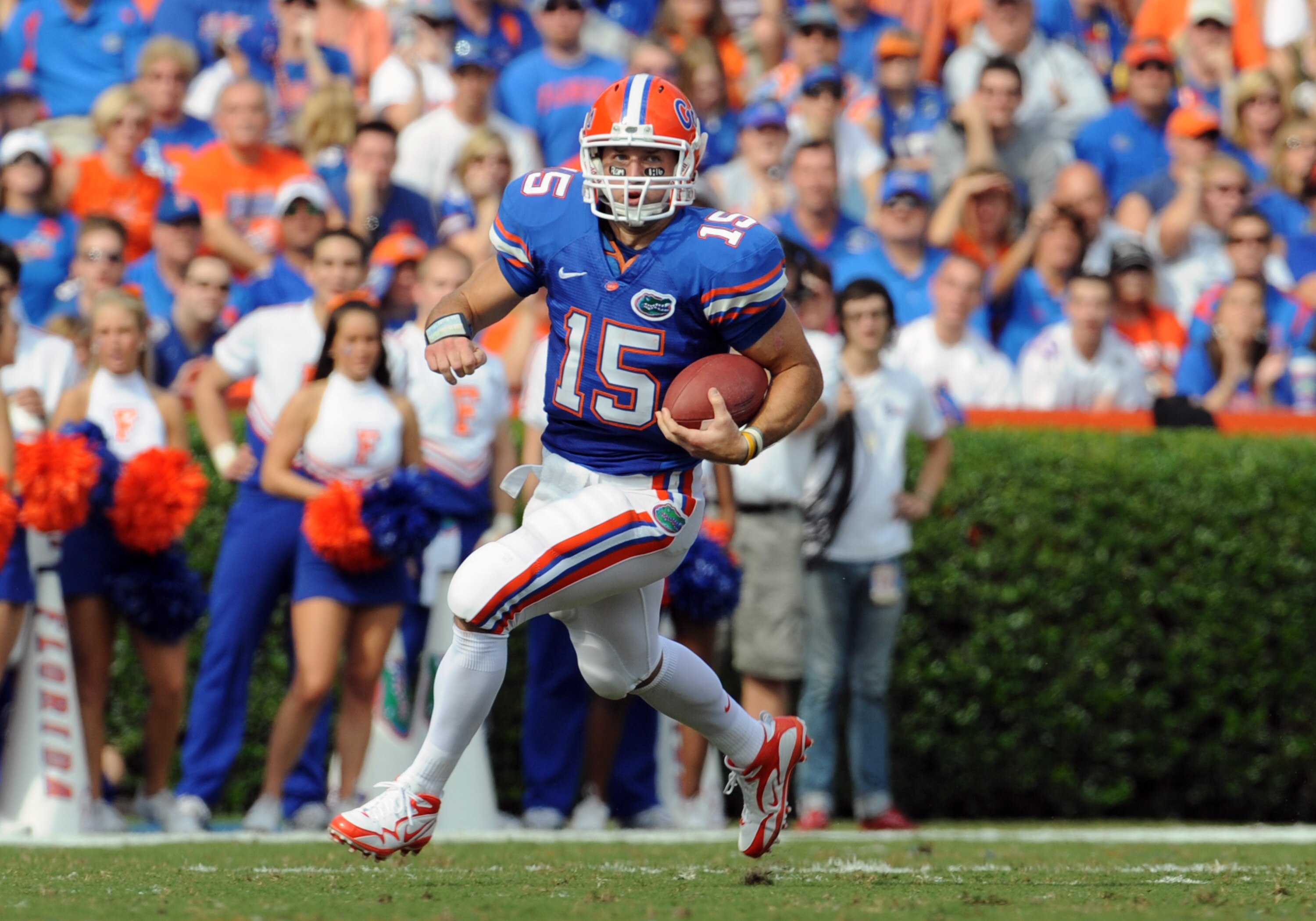 GAINESVILLE, FL - NOVEMBER 21: Quarterback Tim Tebow #15 of the Florida Gators rushes upfield against the Florida International University Golden Panthers, November 21, 2009 at Ben Hill Griffin Stadium in Gainesville, Florida.  (Photo by Al Messerschmidt/