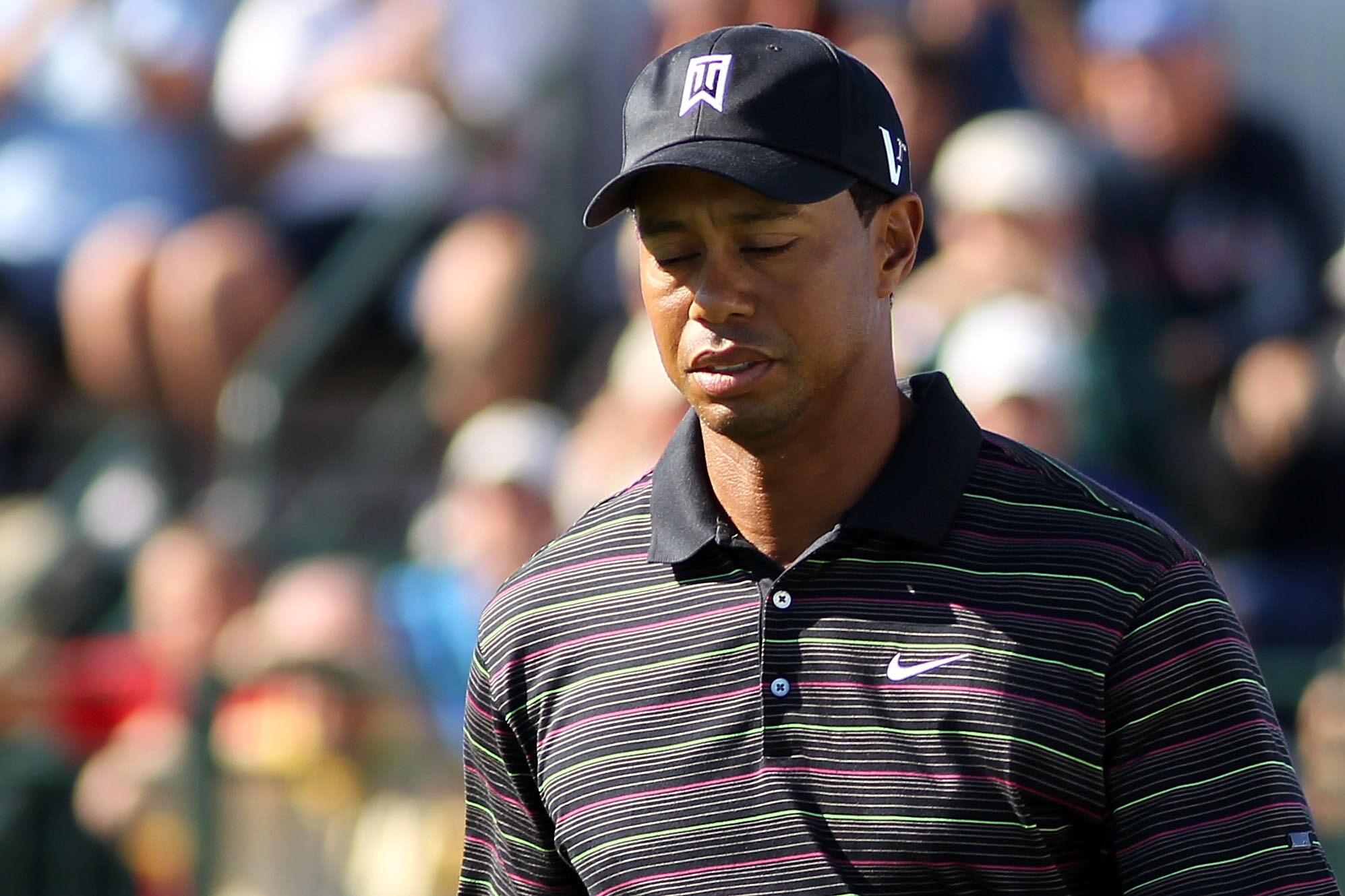 LEMONT, IL - SEPTEMBER 10:  Tiger Woods reacts after his tee shot from the 12th hole during the second round of the BMW Championship at Cog Hill Golf & Country Club on September 10, 2010 in Lemont, Illinois.  (Photo by Maxx Wolfson/Getty Images)