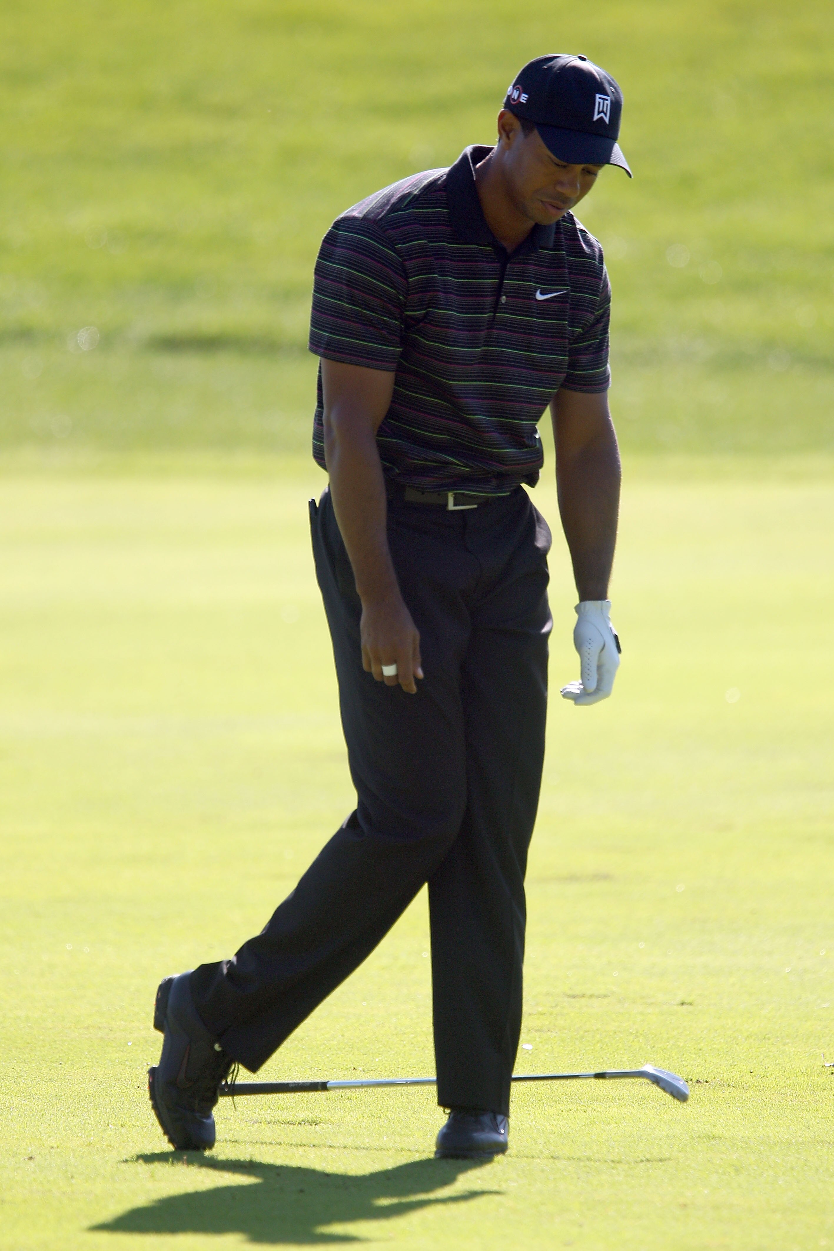 LEMONT, IL - SEPTEMBER 10:  Tiger Woods reacts after an approach shot on the 13th hole during the second round of the BMW Championship at Cog Hill Golf & Country Club on September 10, 2010 in Lemont, Illinois.  (Photo by Scott Halleran/Getty Images)