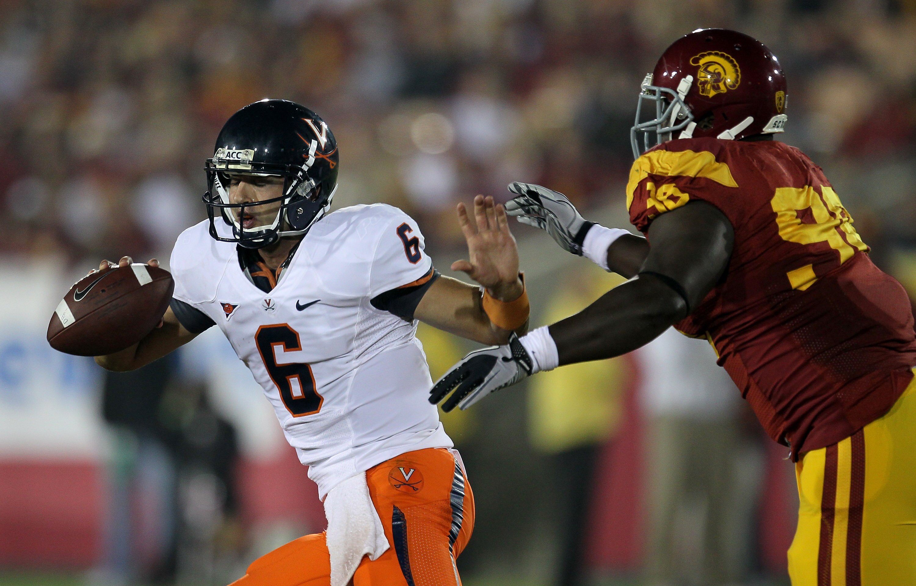 LOS ANGELES, CA - SEPTEMBER 11:  Defensive lineman DaJohn Harris #98 of the USC Trojans sacks quarterback Marc Verica #6 of the Virginia Cavaliers at Los Angeles Memorial Coliseum on September 11, 2010 in Los Angeles, California. USC won 17-14.  (Photo by
