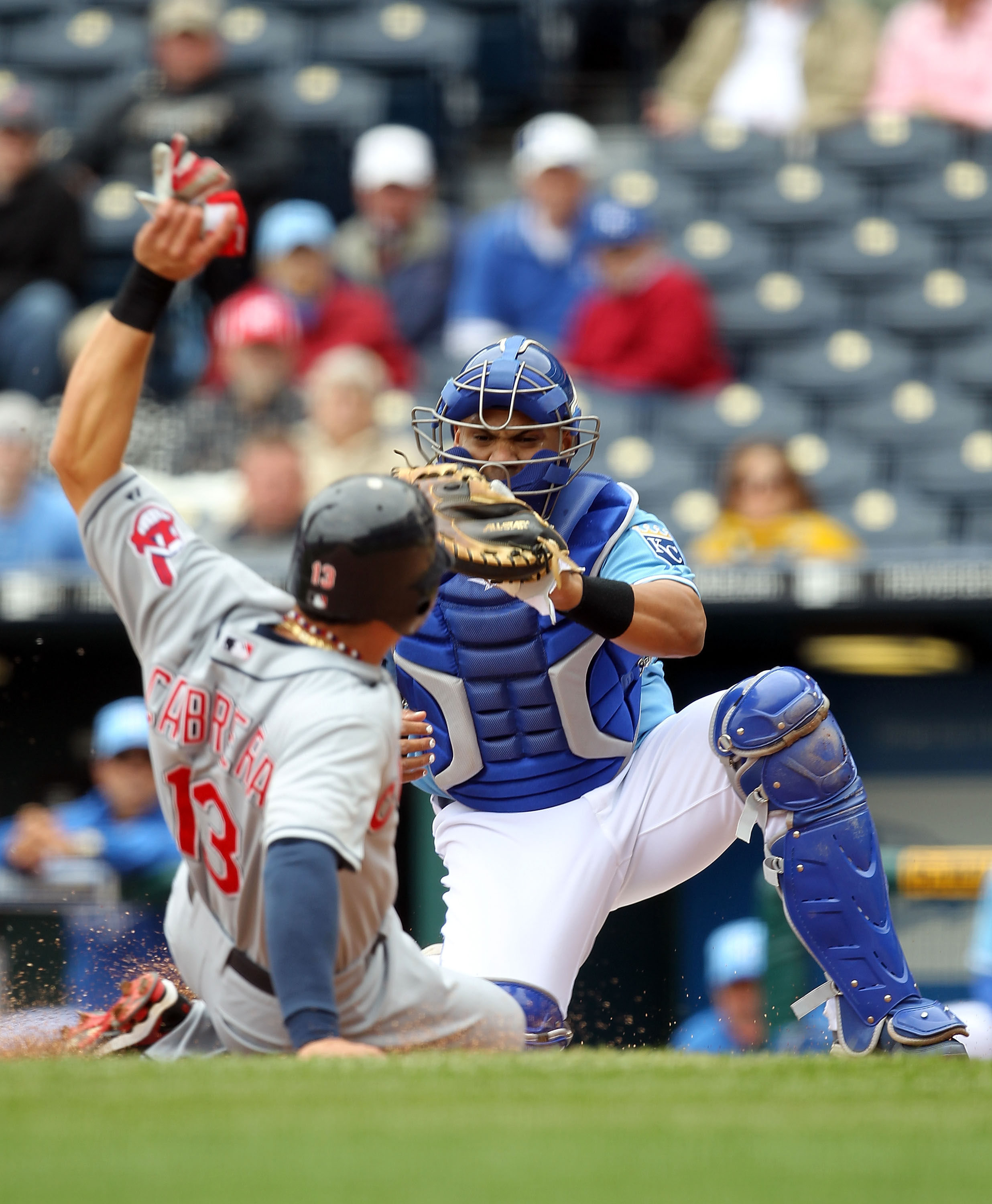 KANSAS CITY, MO - MAY 13: Catcher Brayan Pena #18 of the Kansas City Royals tags out Asdrubal Cabrera #13 of the Cleveland Indians in a play at the plate during the first inning of the game on May 13, 2010 at Kauffman Stadium in Kansas City, Missouri. ( KANSAS CITY, MO - MAY 13: Catcher Brayan Pena #18 of the Kansas City Royals tags out Asdrubal Cabrera #13 of the Cleveland Indians in a play at the plate during the first inning of the game on May 13, 2010 at Kauffman Stadium in Kansas City, Missouri. (