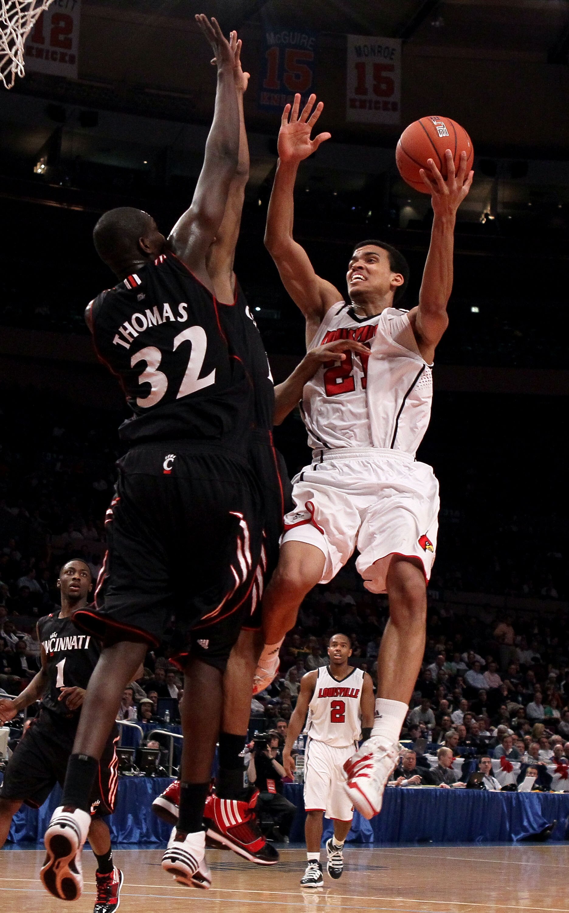 NEW YORK - MARCH 10: Jared Swopshire #21 of the Louisville Cardinals goes to the hoop against Ibrahima Thomas #32 of the Cincinnati Bearcats during the second round of 2010 NCAA Big East Tournament at Madison Square Garden on March 10, 2010 in New York Ci