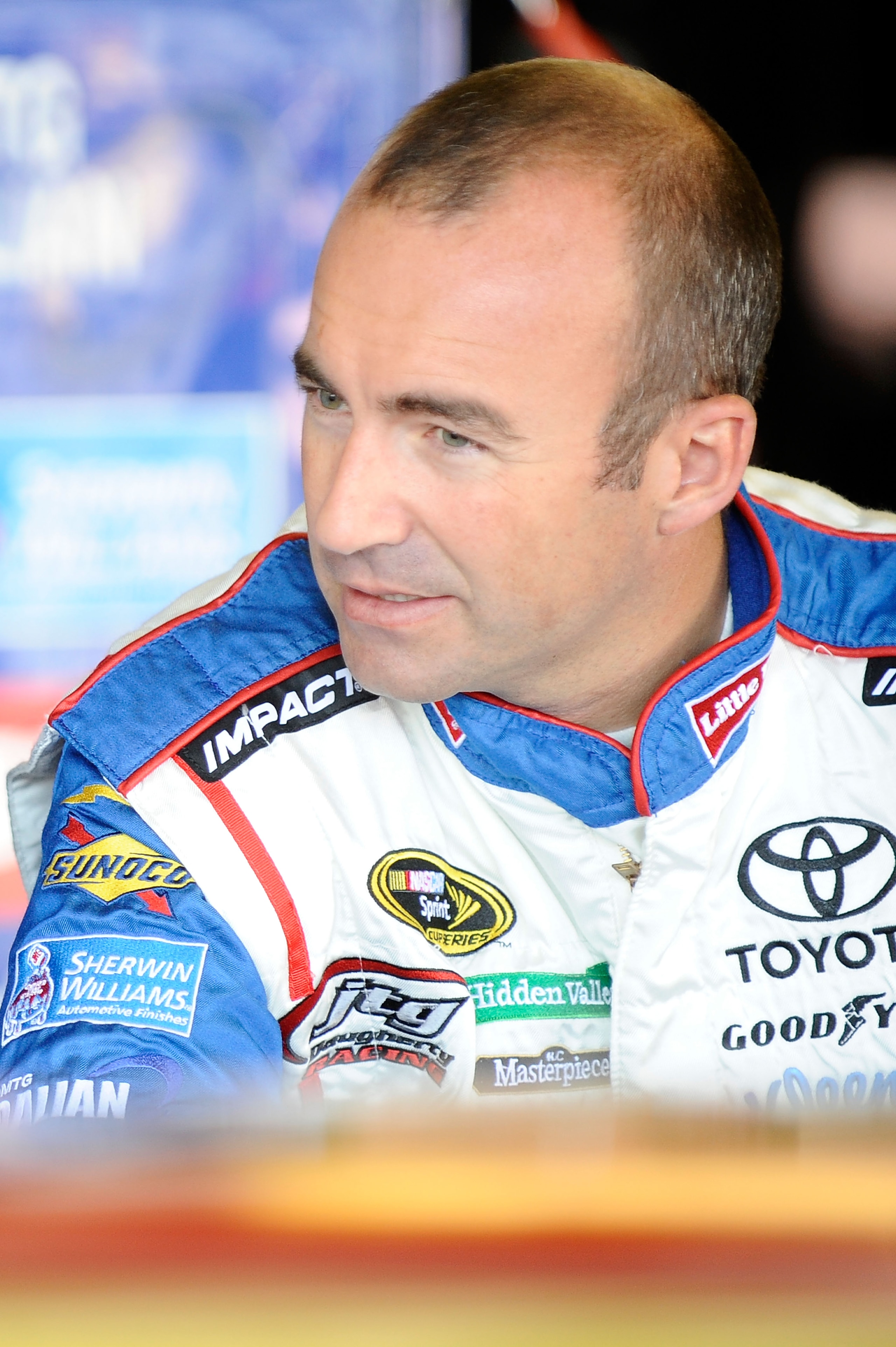 WATKINS GLEN, NY - AUGUST 06:  Marcos Ambrose, driver of the #47 Little Debbie Toyota, stands in the garage during practice for the NASCAR Heluva Good! Sour Cream Dips at The Glen on August 6, 2010 in Watkins Glen, New York.  (Photo by Jeff Zelevansky/Get