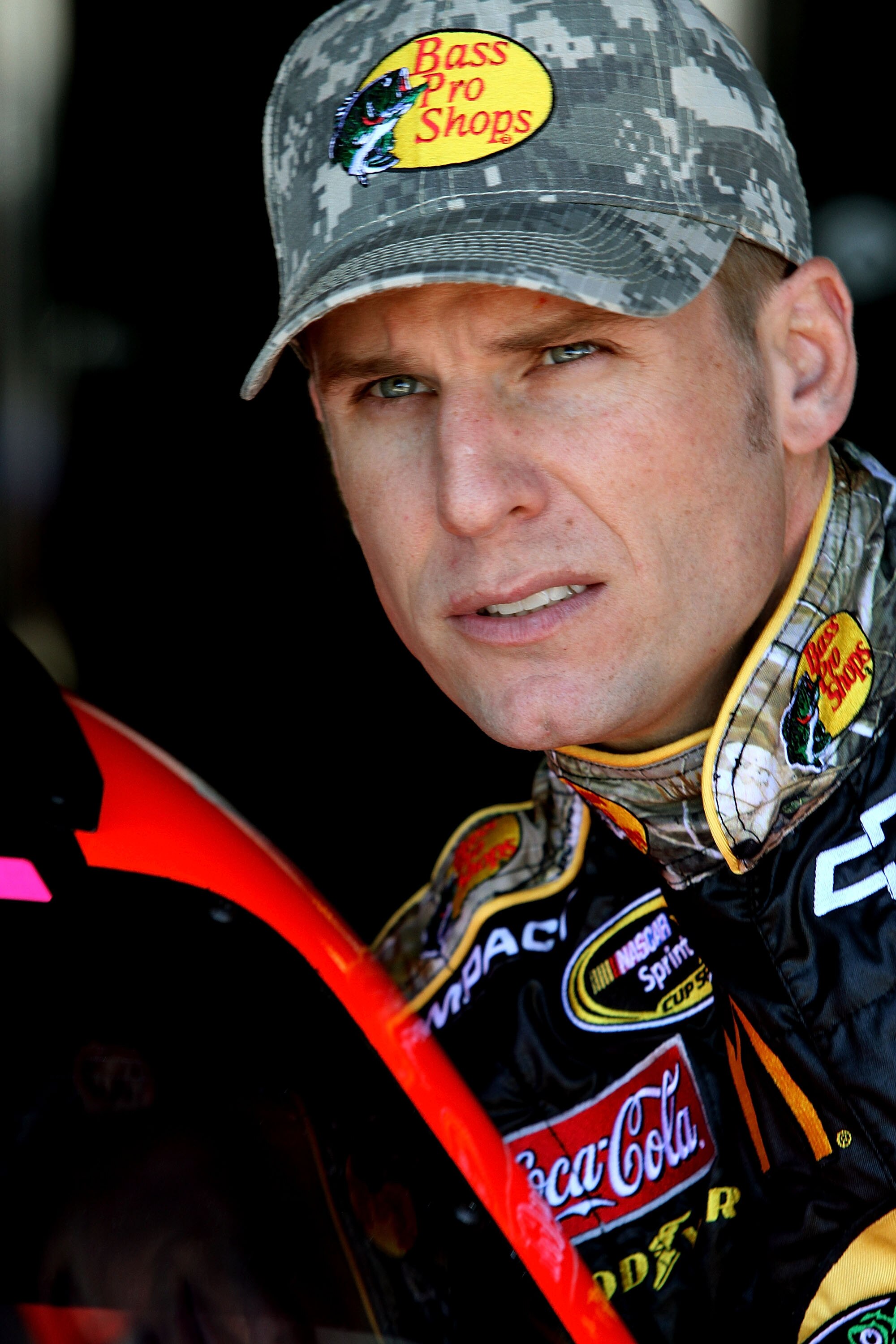 RICHMOND, VA - SEPTEMBER 10:  Jamie McMurray, driver of the #1 Bass Pro Shops/Tracker Chevrolet, climbs in his car in the garage during practice for the NASCAR Sprint Cup Series Air Guard 400 at Richmond International Raceway on September 10, 2010 in Rich