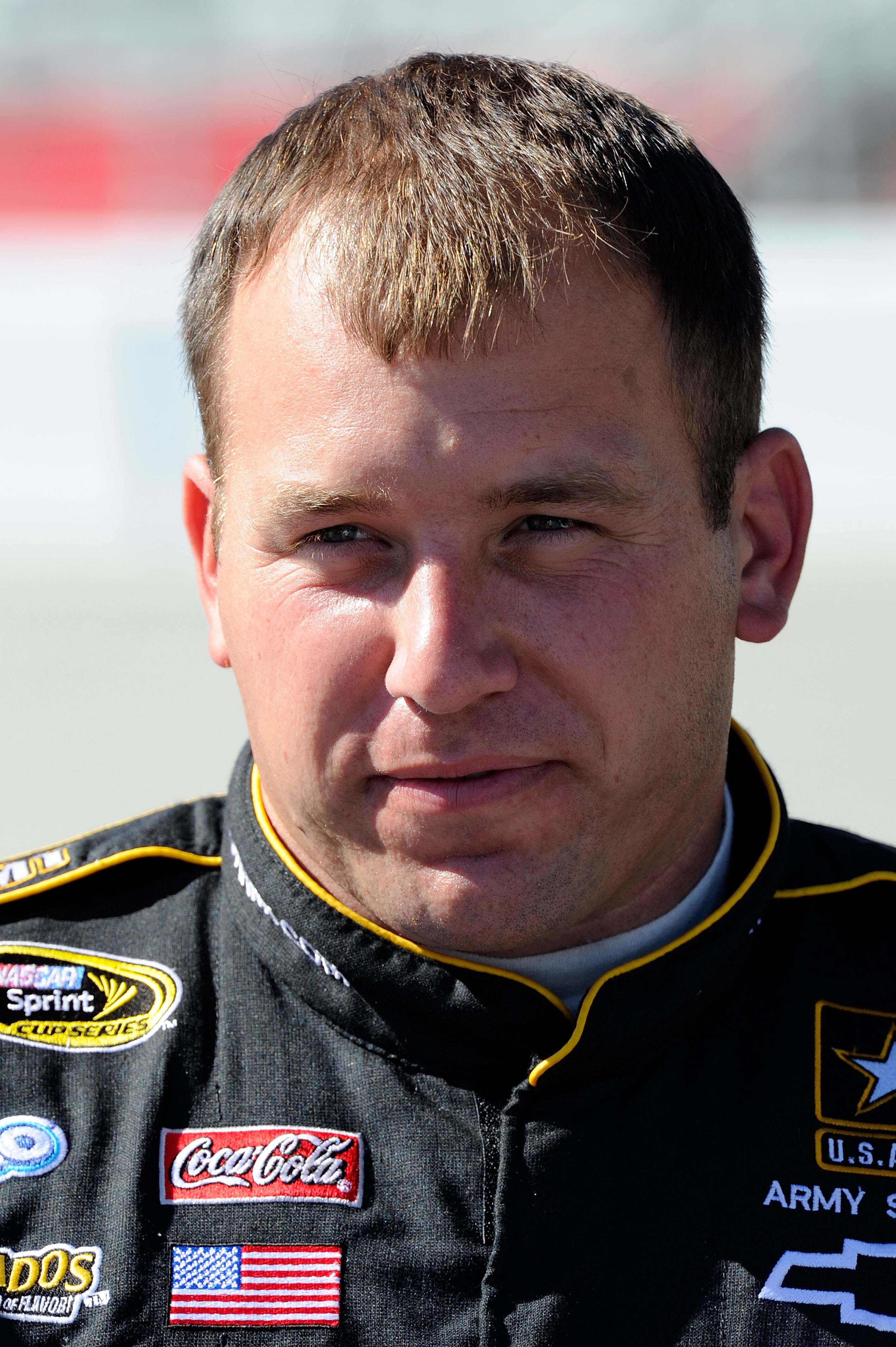 HAMPTON, GA - SEPTEMBER 04:  Ryan Newman, driver of the #39 US Army Chevrolet, stands on the grid during qualifying for the NASCAR Sprint Cup Series Emory Healthcare 500 at Atlanta Motor Speedway on September 4, 2010 in Hampton, Georgia.  (Photo by John H