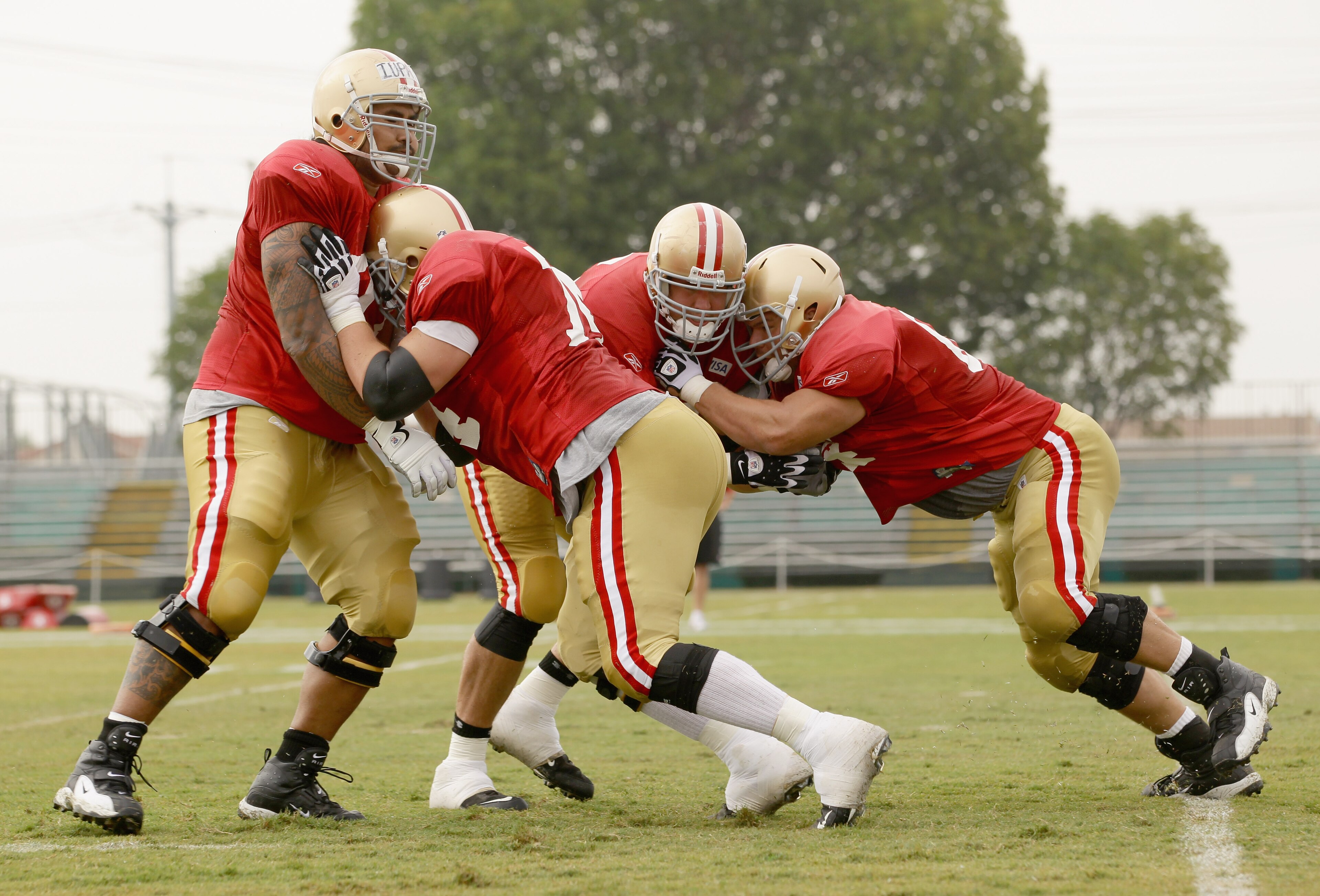 SANTA CLARA, CA - AUGUST 02:  Joe Staley #74 and Mike Iupati #77 work out during the San Francisco 49ers training camp at their training complex on August 2, 2010 in Santa Clara, California.  (Photo by Ezra Shaw/Getty Images)