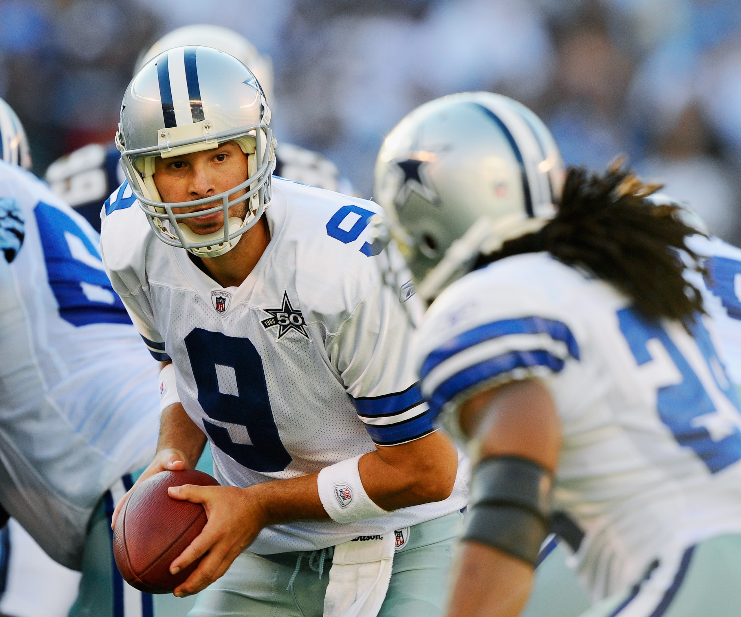 SAN DIEGO - AUGUST 21:  Quarterback Tony Romo #9 of the Dallas Cowboys looks to hand off the ball to running back Marion Barber #24 their preseason NFL football game against San Diego Chargers at Qualcomm Stadium on August 21, 2010 in San Diego, Californi