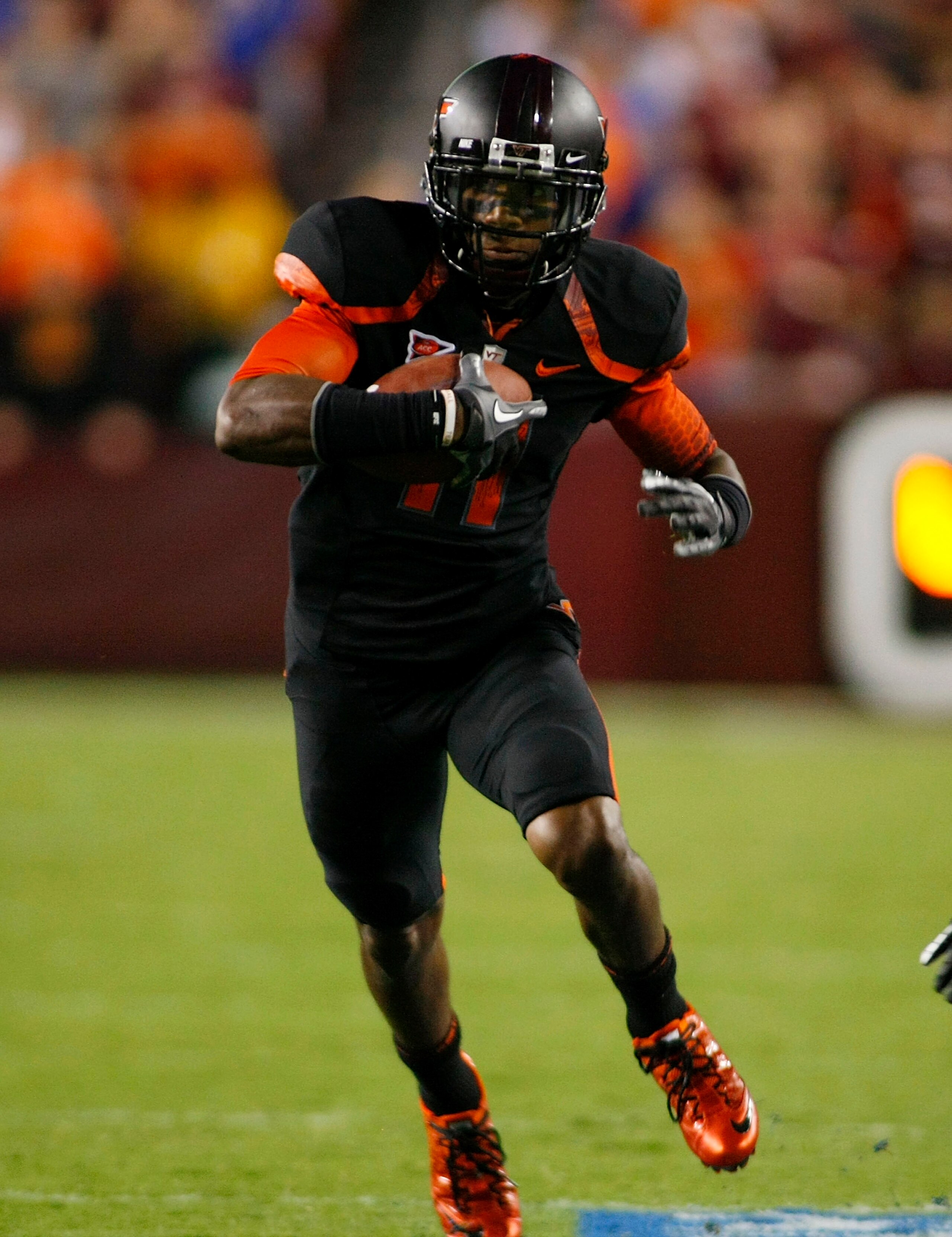 LANDOVER, MD - SEPTEMBER 06:  Wide reciever Dyrell Roberts #11 of the Virginia Tech Hokies runs with the ball against the Boise State Broncos at FedExField on September 6, 2010 in Landover, Maryland.  (Photo by Geoff Burke/Getty Images)