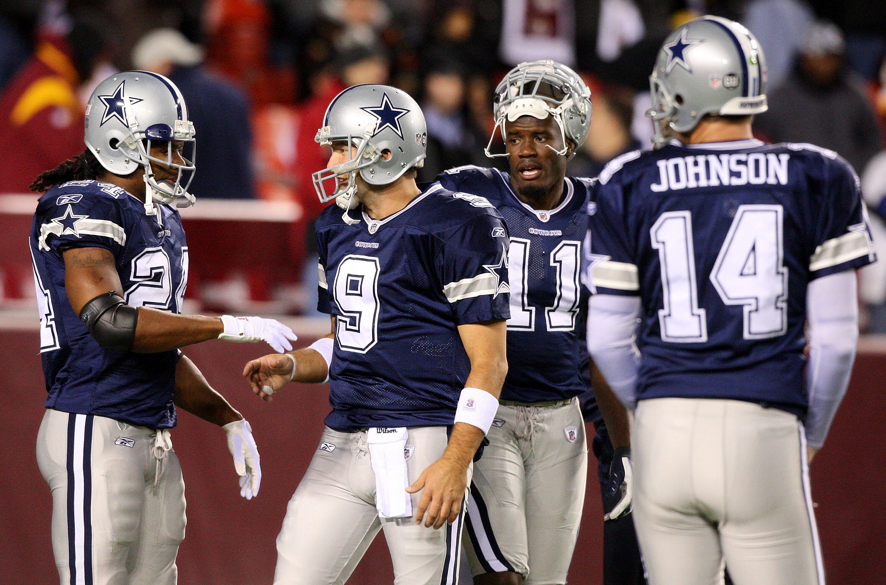 LANDOVER, MD - NOVEMBER 16:  Marion Barber #24 and Tony Romo #9 of the Dallas Cowboys talk during warmups while teammates Roy Williams #11 and Brad Johnson #14 look on before the game against the Washington Redskins on November 16, 2008 at FedEx Field in