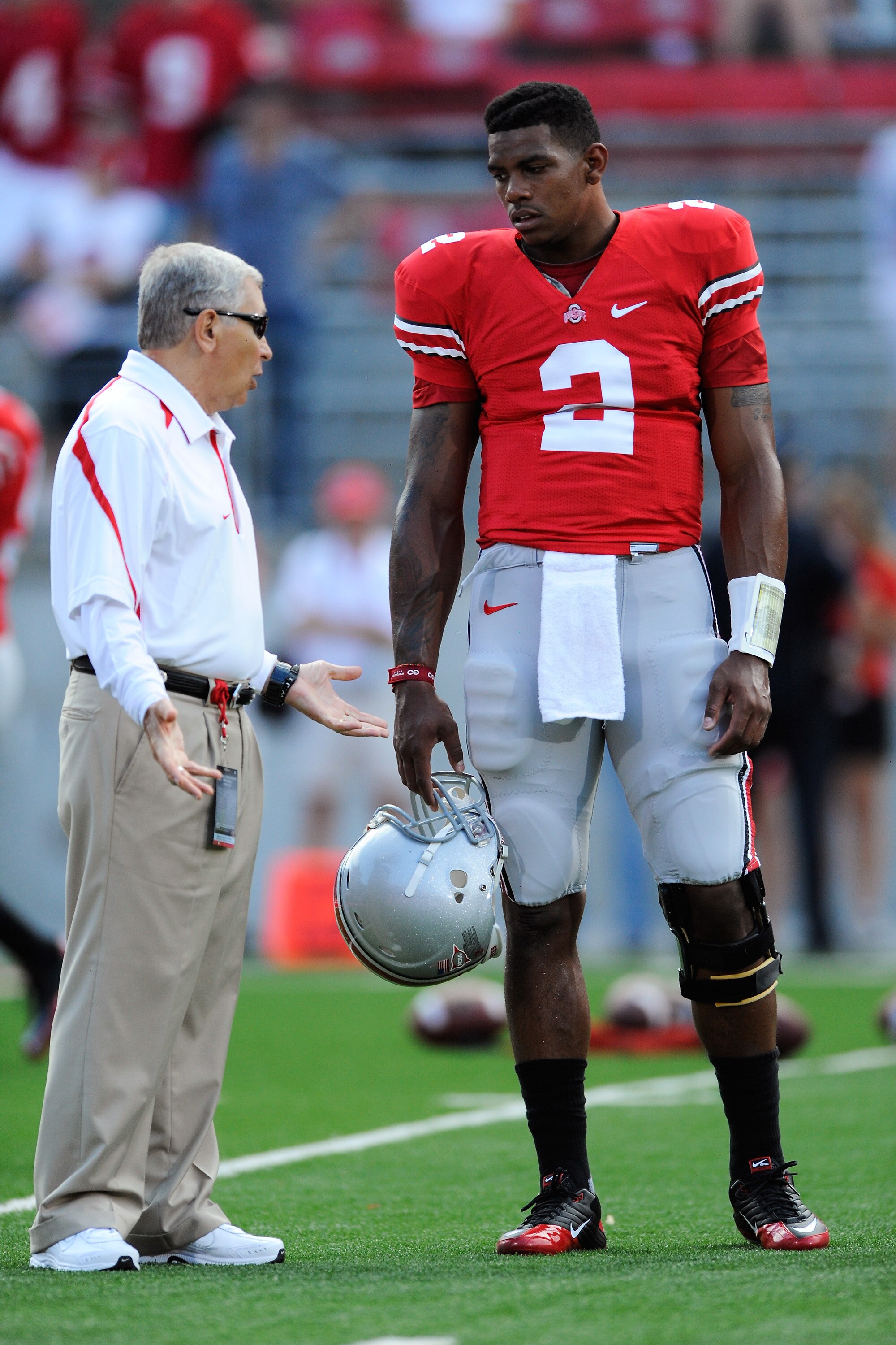 COLUMBUS, OH - SEPTEMBER 2:  Terrelle Pryor #2 of the Ohio State Buckeyes gets pregame advice from assistant coach Joe Daniels before their game against the Marshall Thundering Herd at Ohio Stadium on September 2, 2010 in Columbus, Ohio.  (Photo by Jamie