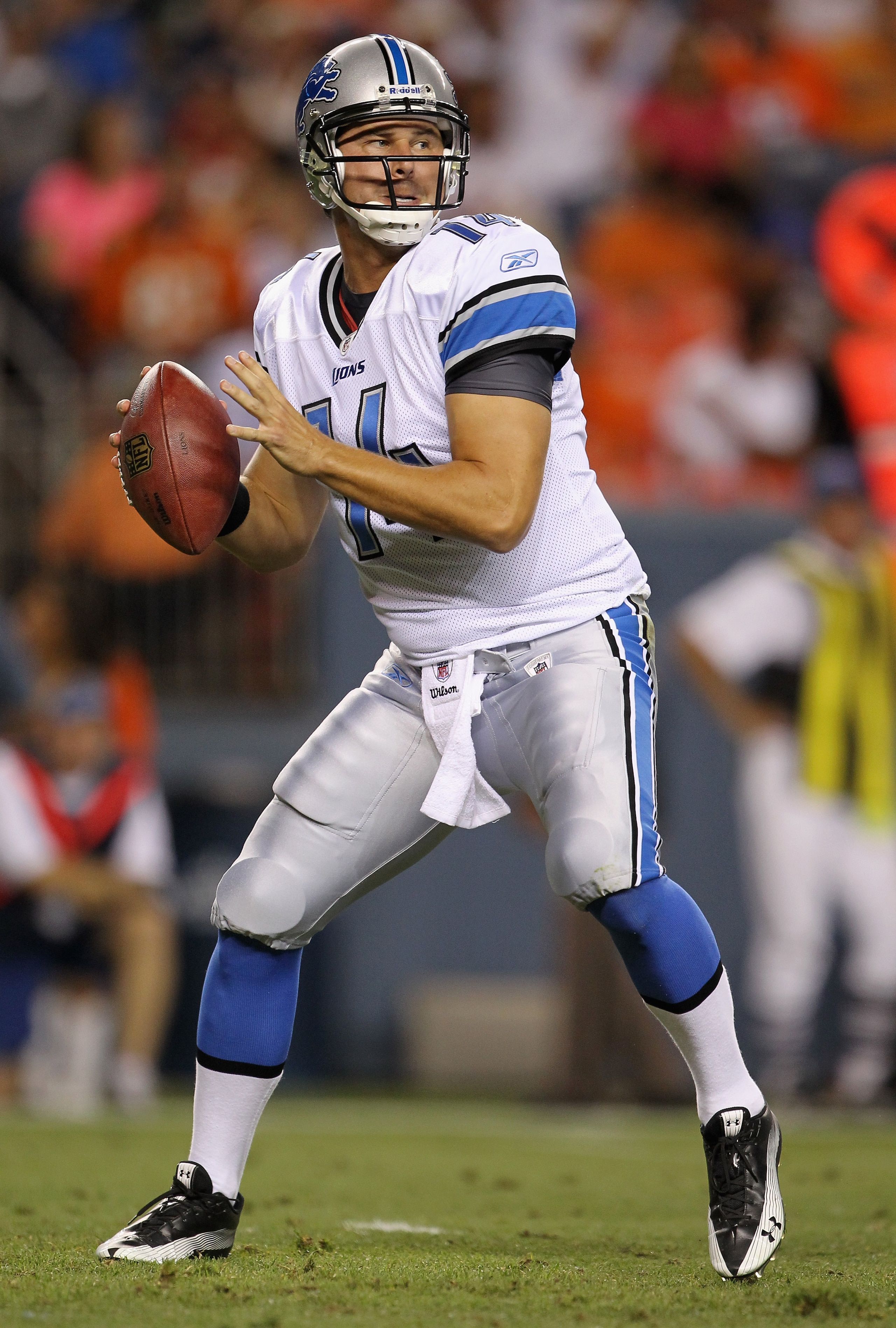 DENVER - AUGUST 21:  Quarterback Shaun Hill #14 of the Detroit Lions looks to deliver a pass against the Denver Broncos during preseason NFL action at INVESCO Field at Mile High on August 21, 2010 in Denver, Colorado. The Lions defeated the Broncos 25-20.