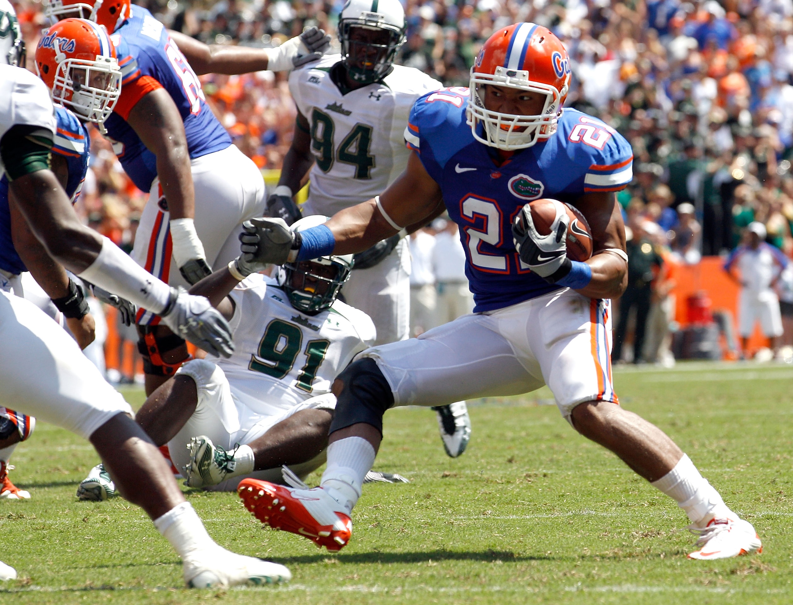GAINESVILLE, FL - SEPTEMBER 11:  Emmanuel Moody #21 of the Florida Gators attempts to run for yardage against the South Florida Bulls during a game at Ben Hill Griffin Stadium on September 11, 2010 in Gainesville, Florida.  (Photo by Sam Greenwood/Getty I