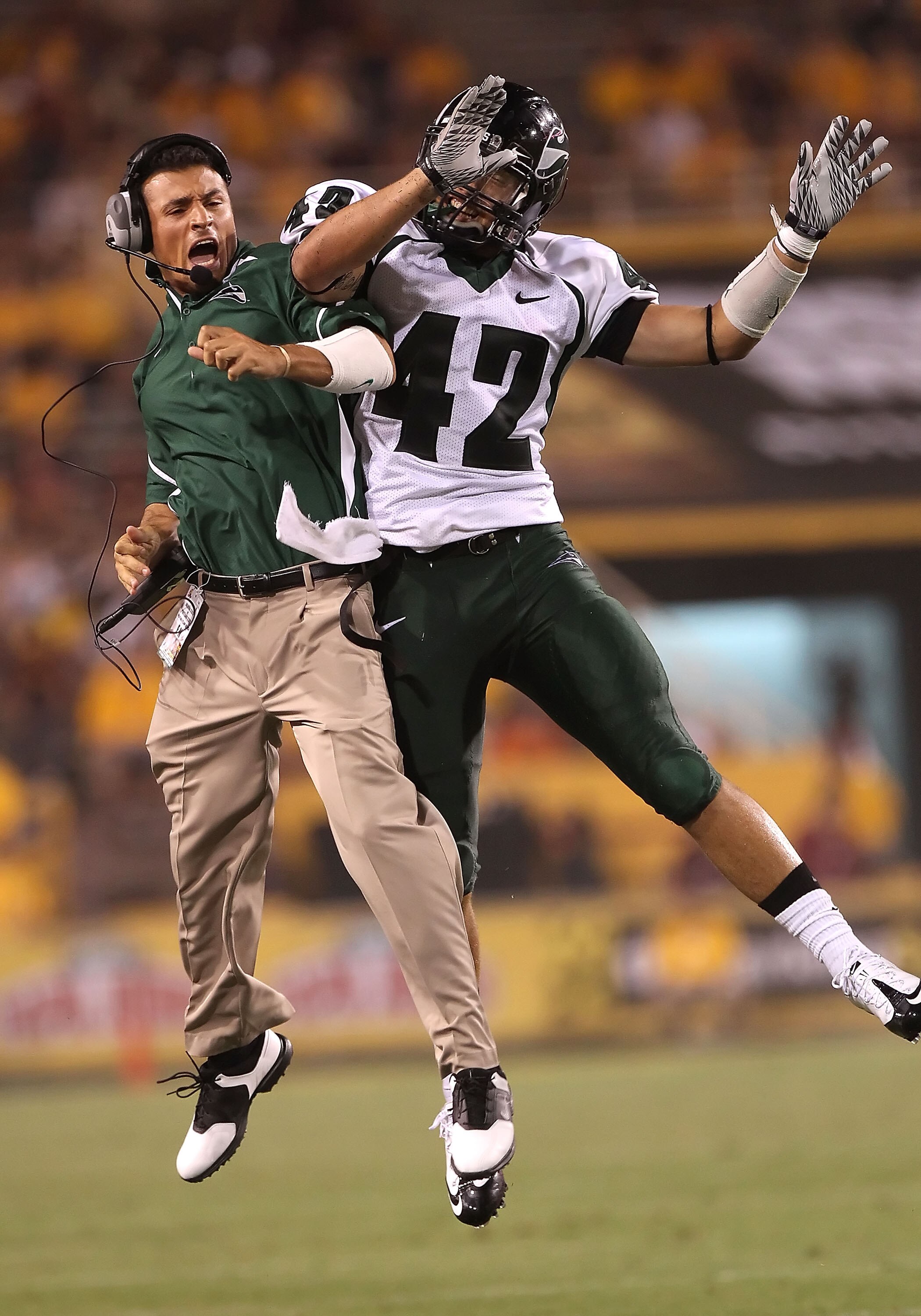 TEMPE, AZ - SEPTEMBER 04:  Coach Ahmed Zarrugh and Joel Sisler #42 of the Portland State Vikings celebrate after Sisler intercepted a third quarter pass during the college football game against the Arizona State Sun Devils at Sun Devil Stadium on Septembe
