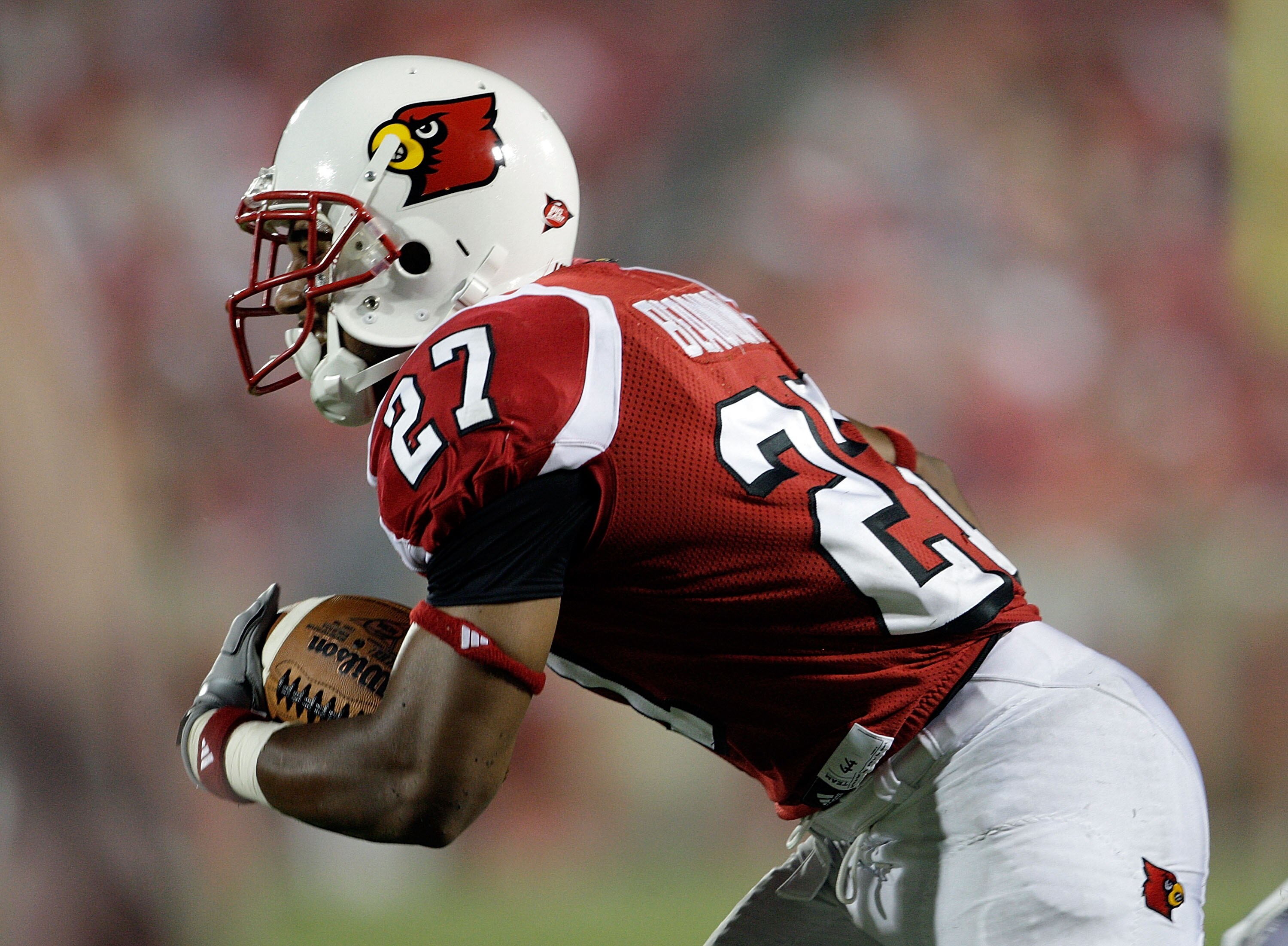 LOUISVILLE, KY - SEPTEMBER 05:  Doug Beaumont #27 of the Louisville Cardinals runs with the ball after a reception during the game against the Indiana State Sycamores at Papa John's Cardinal Stadium on September 5, 2009 in Louisville, Kentucky.  (Photo by