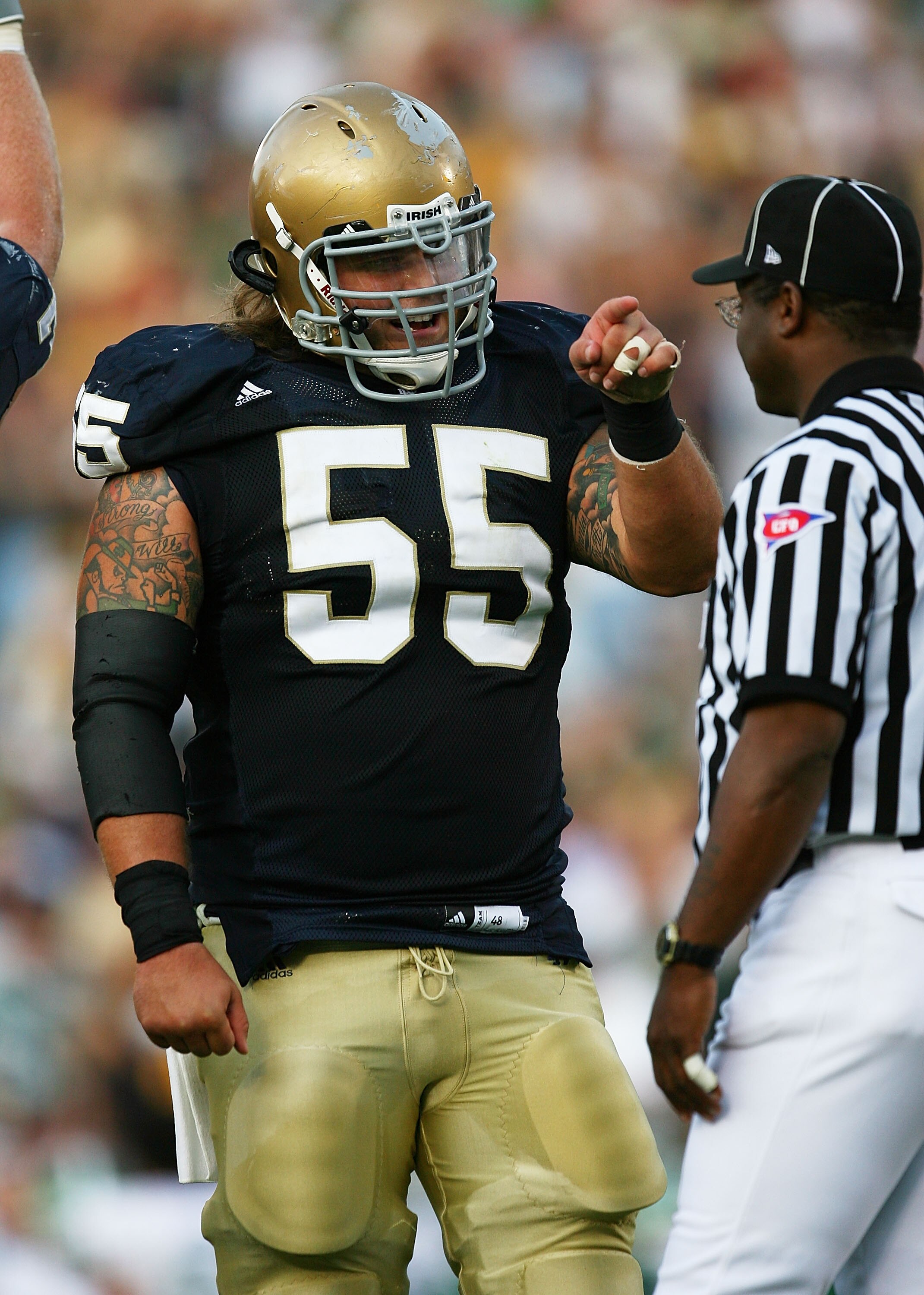 SOUTH BEND, IN - SETPEMBER 19: Eric Olsen #55 of the Notre Dame Fighting Irish points to a referee after a replay showed Notre Dame scored a touchdown against the Michigan State Spartans on September 19, 2009 at Notre Dame Stadium in South Bend, Indiana.