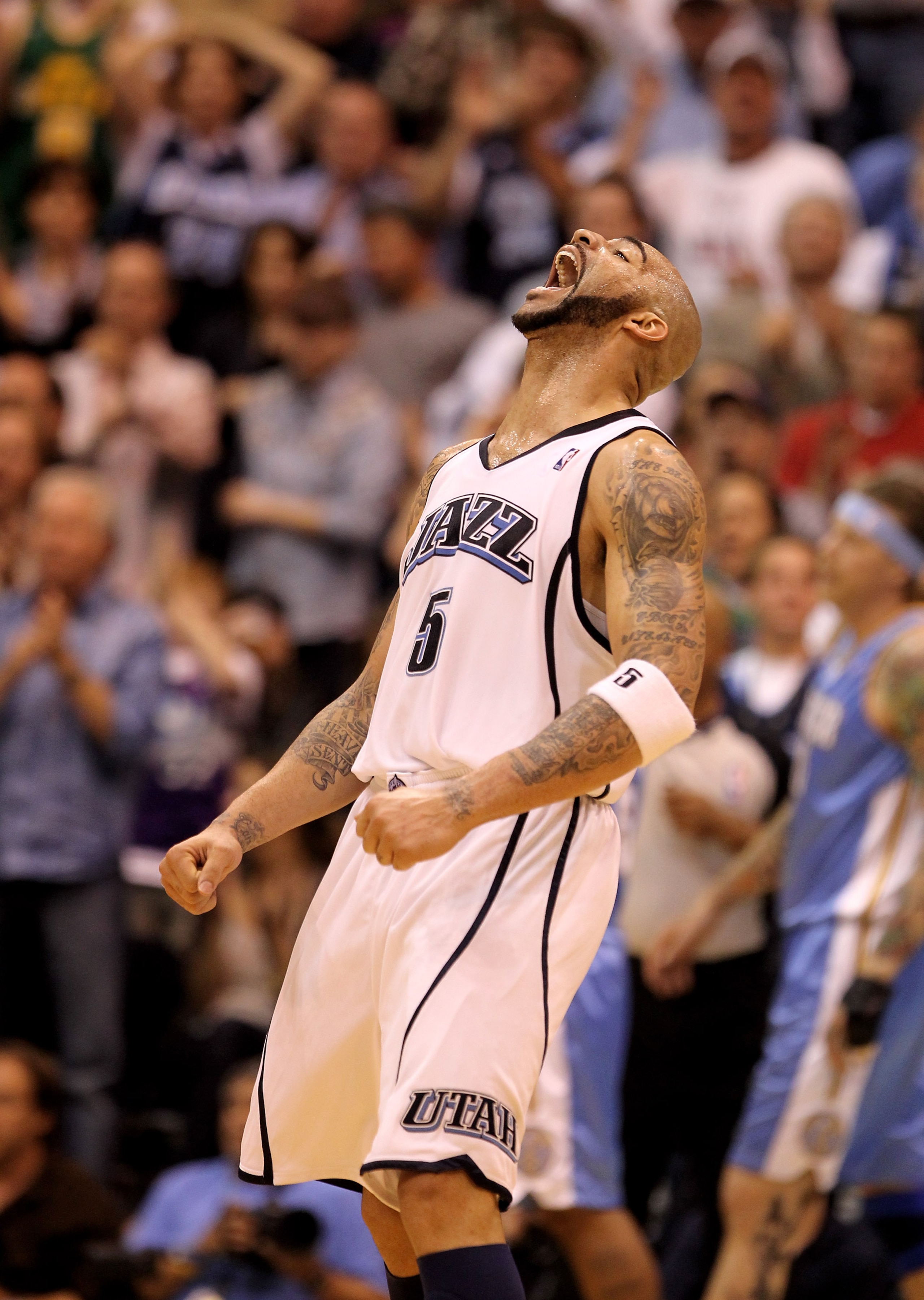 SALT LAKE CITY - APRIL 30:  Carlos Boozer #5 of the Utah Jazz celebrates after the Jazz went ahead 76-75 in the third period of their game against the Denver Nuggets during Game Six of the Western Conference Quarterfinals of the 2010 NBA Playoffs at Energ