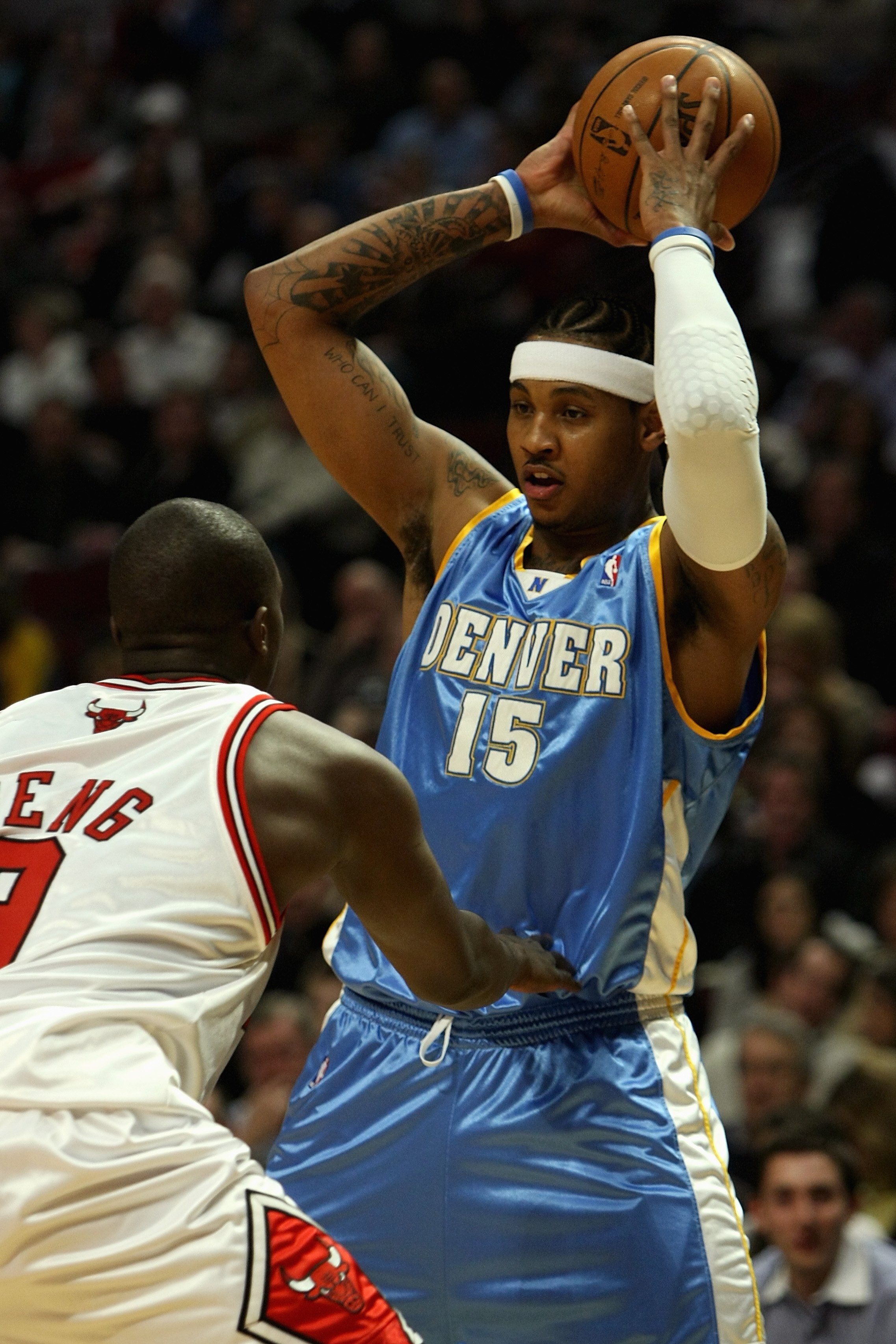 CHICAGO - FEBRUARY 22:  Carmelo Anthony #15 of the Denver Nuggets looks to pass over Luol Deng #9 of the Chicago Bulls during the game on February 22, 2008 at the United Center in Chicago, Illinois. The Bulls won 135-121. NOTE TO USER: User expressly ackn