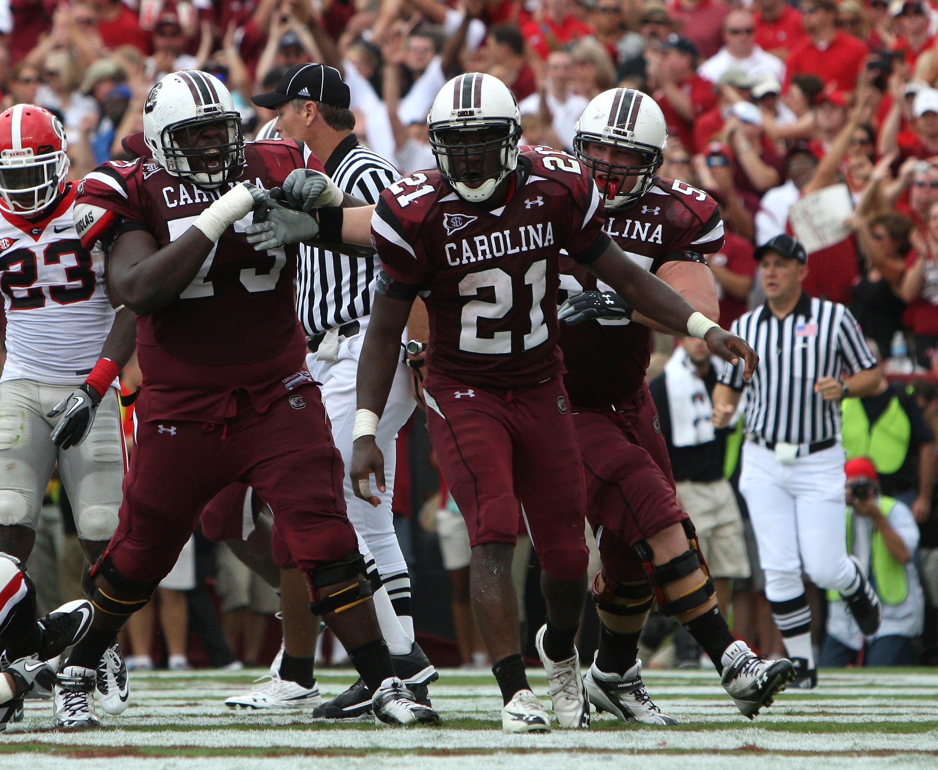 COLUMBIA, SC - SEPTEMBER 11: Tailback Marcus Lattimore #21 of the South Carolina Gamecocks celebrates with teammates after his second quarter touchdown during the game against the Georgia Bulldogs at Williams-Brice Stadium on September 11, 2010 in Columbi
