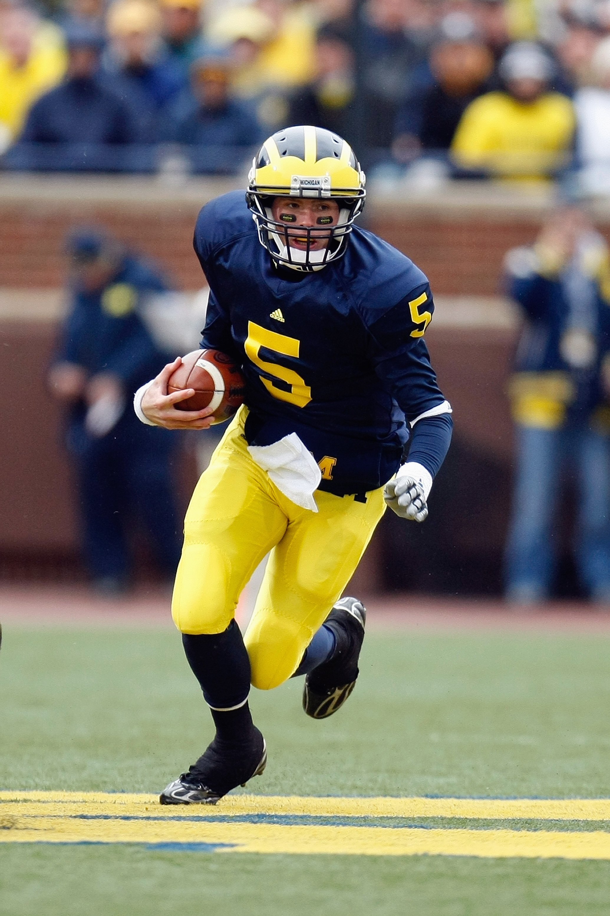 ANN ARBOR, MI - OCTOBER 24:  Tate Forcier #5 of the Michigan Wolverines carries the ball during the game against the Penn State Nittany Lions on October 24, 2009 at Michigan Stadium in Ann Arbor, Michigan. (Photo by  Gregory Shamus/Getty Images)