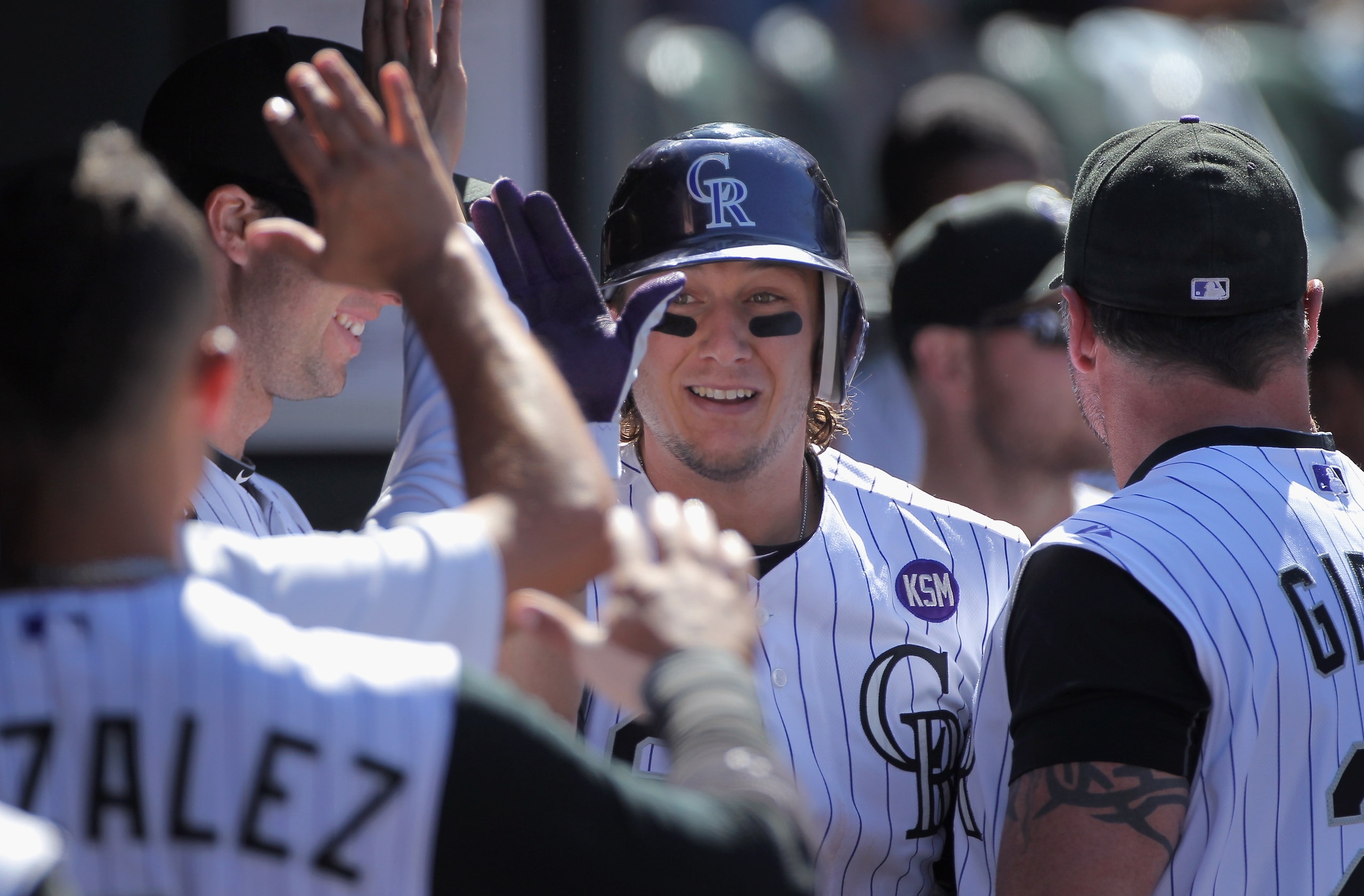 DENVER - SEPTEMBER 06:  Shortstop Troy Tulowitski #2 of the Colorado Rockies is welcomed back to the dugout after his solo home run off of relief pitcher Bill Bray of the Cincinnati Reds in the fifth inning at Coors Field on September 6, 2010 in Denver, C