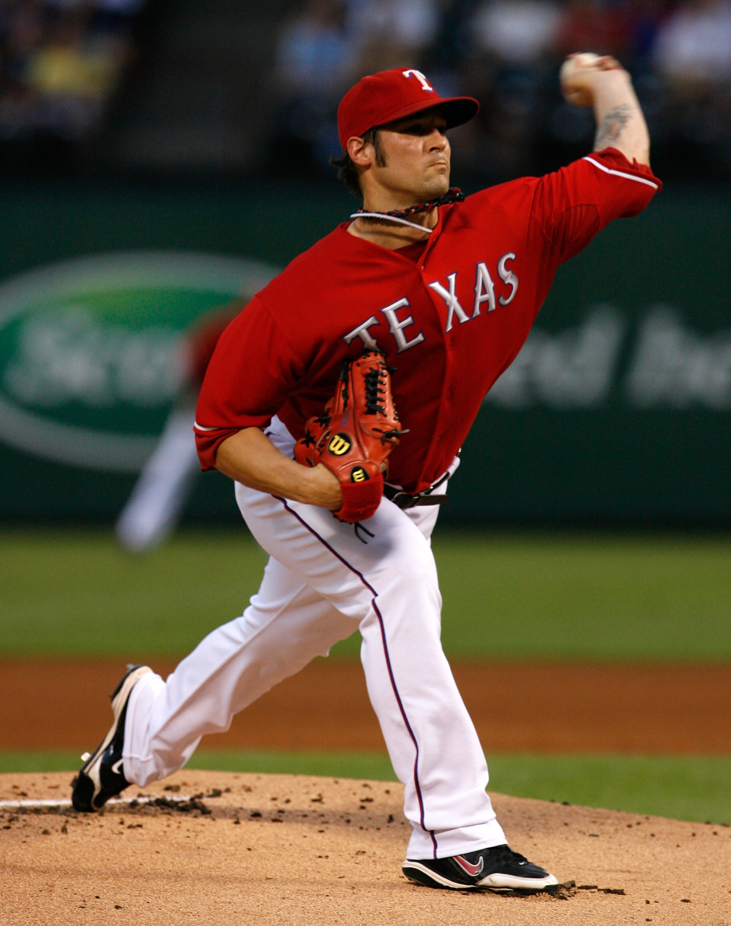 ARLINGTON, TX - SEPTEMBER 10:  Starting pitcher C.J. Wilson #36 of the Texas Rangers pitches against the New York Yankees on September 10, 2010 at Rangers Ballpark in Arlington, Texas.  (Photo by Tom Pennington/Getty Images)