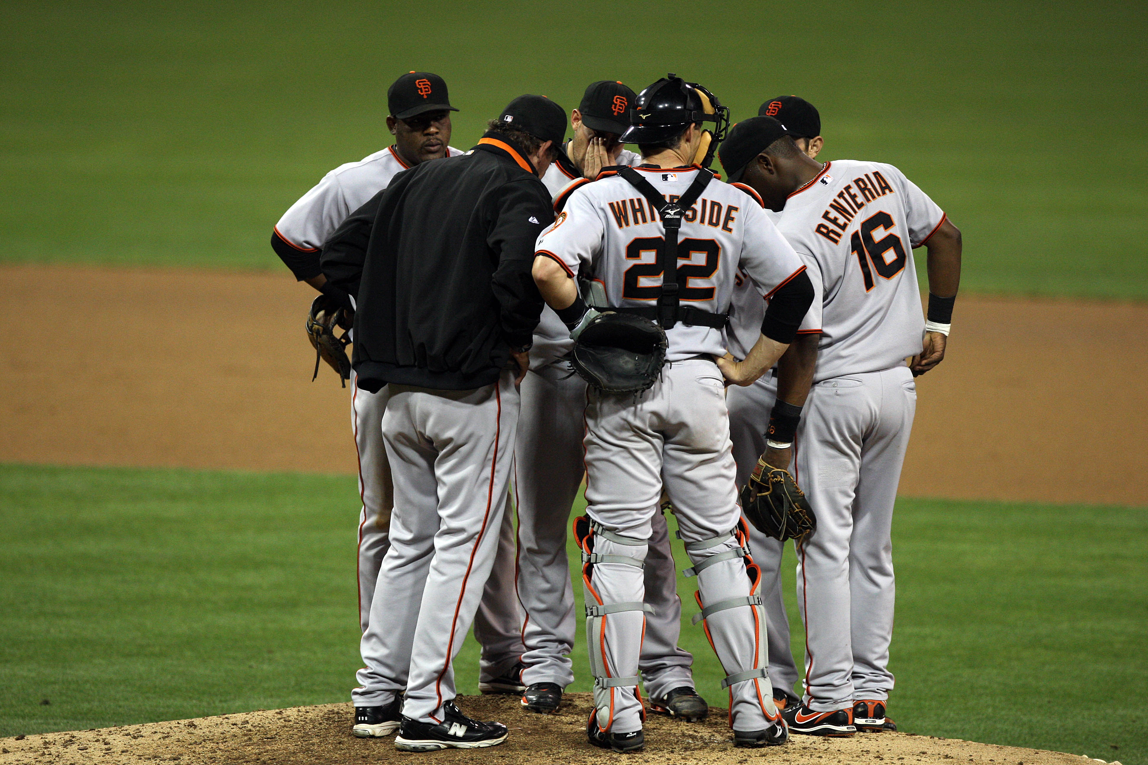 SAN DIEGO, CA - SEPTEMBER 10:  Members of the San Francisco Giants huddle around Starting Pitcher Jonathan Sanchez #57 during their MLB game against he San Diego Padres on September 10, 2010 at Petco Park in San Diego, California. (Photo by Donald Miralle