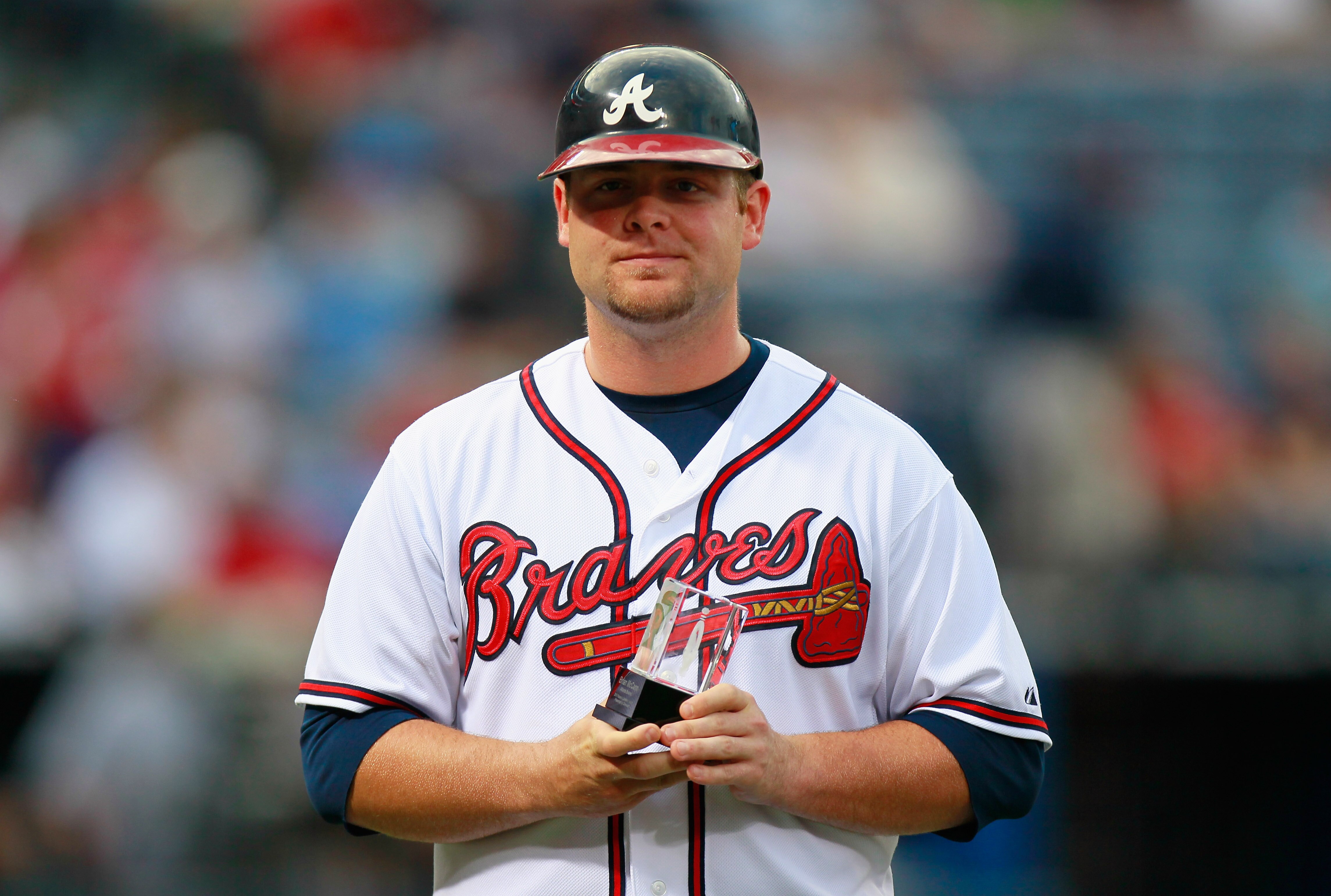 ATLANTA - SEPTEMBER 09:  Brian McCann #16 of the Atlanta Braves accepts his nomination for the Roberto Clemente Award before facing the St. Louis Cardinals at Turner Field on September 9, 2010 in Atlanta, Georgia.  (Photo by Kevin C. Cox/Getty Images)