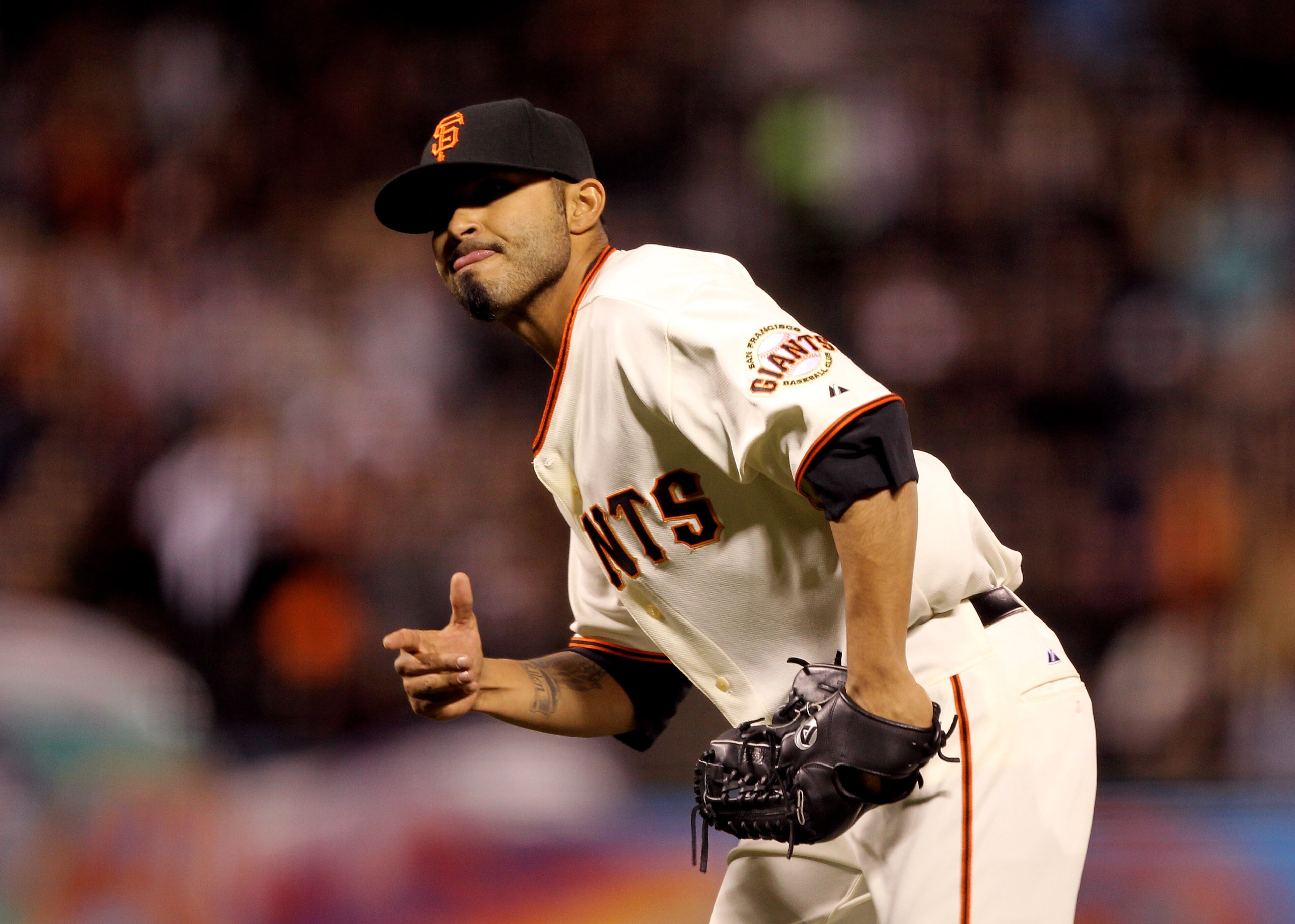 SAN FRANCISCO - APRIL 12:  Sergio Romo #54 of the San Francisco Giants reacts after striking out Lastings Milledge #85 of the Pittsburgh Pirates to end the seventh inning at AT&T Park on April 12, 2010 in San Francisco, California.  (Photo by Ezra Shaw/Ge