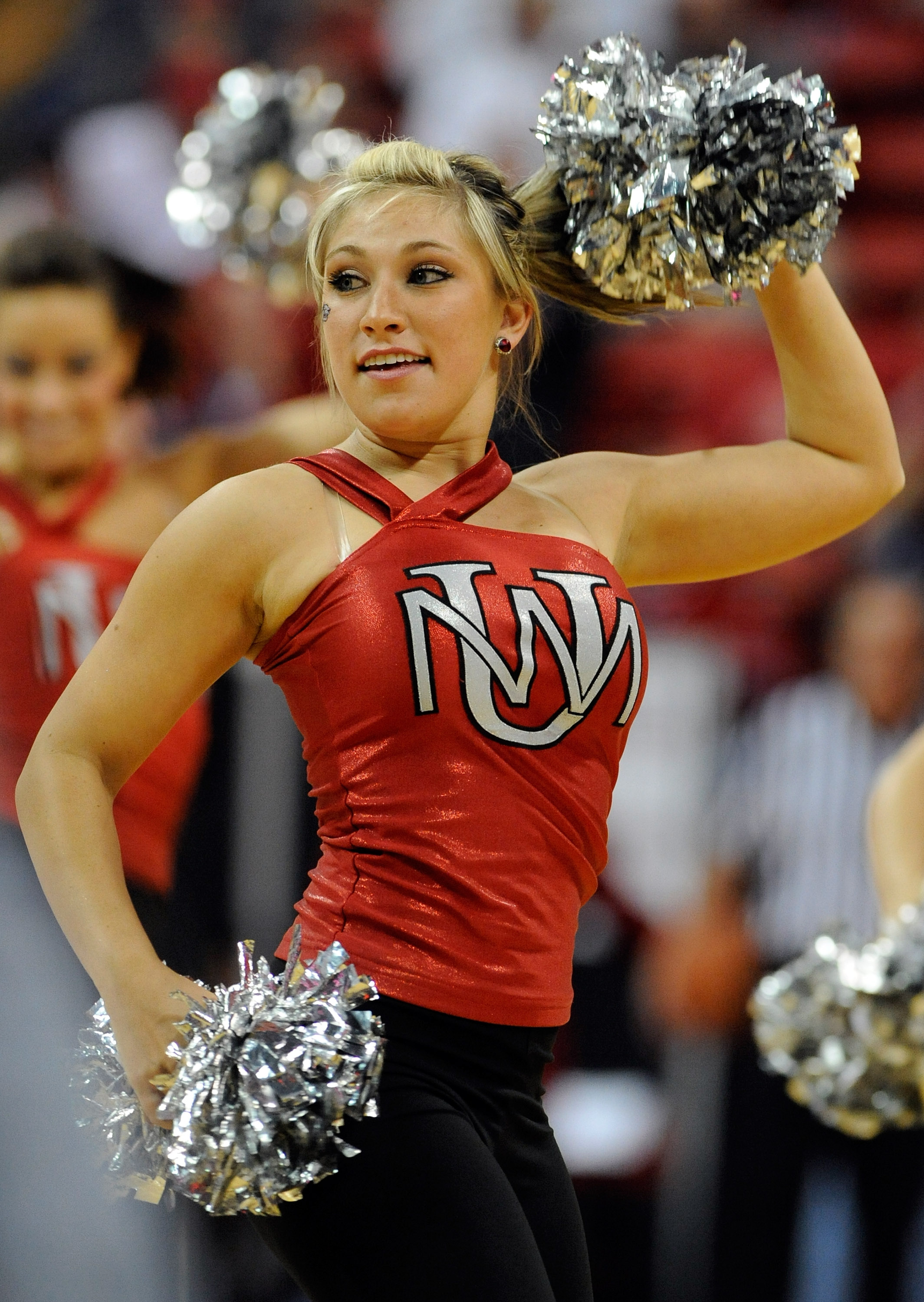 LAS VEGAS - MARCH 12:  A New Mexico Lobos cheerleader performs during a semifinal game against the San Diego State Aztecs at the Conoco Mountain West Conference Basketball tournament at the Thomas & Mack Center March 12, 2010 in Las Vegas, Nevada. San Die
