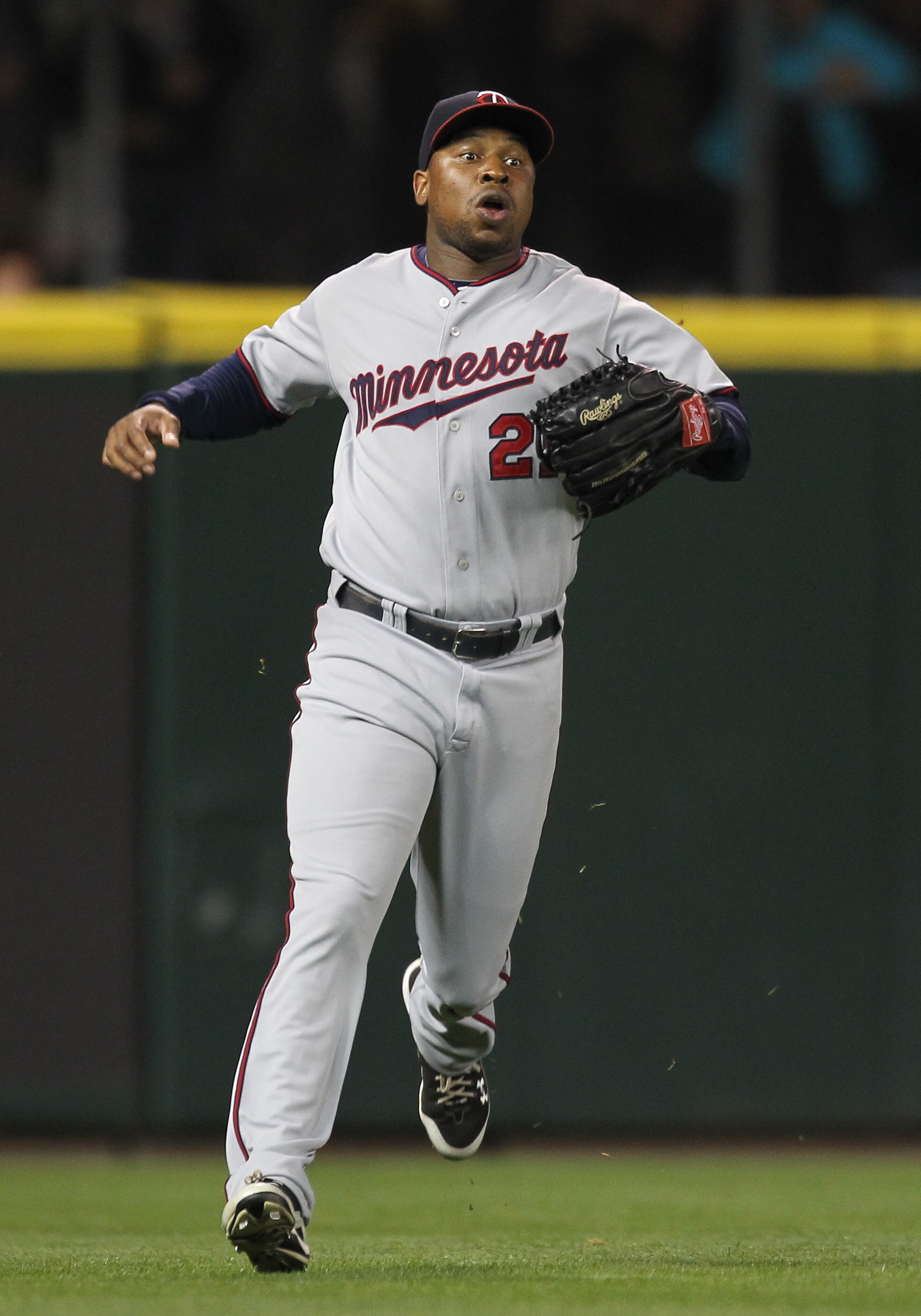 SEATTLE - AUGUST 27:  Left fielder Delmon Young #21 of the Minnesota Twins charges a base hit against the Seattle Mariners at Safeco Field on August 27, 2010 in Seattle, Washington. The Twins won 6-3. (Photo by Otto Greule Jr/Getty Images)