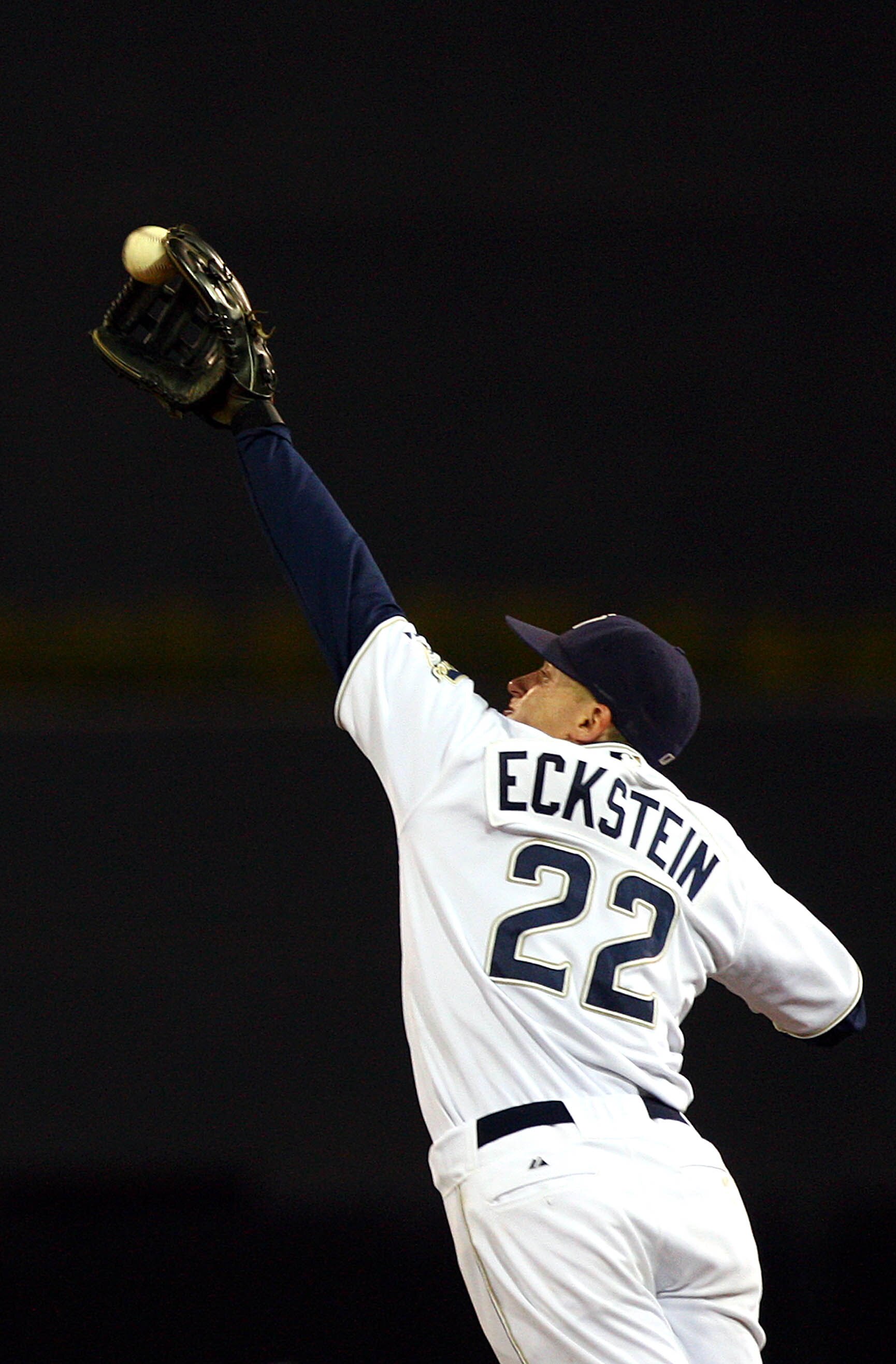 SAN DIEGO, CA - SEPTEMBER 10:  2nd Baseman David Eckstein #22 of the San Diego Padres jumps up to catch the ball for an out against the San Francisco Giants during their MLB game on September 10, 2010 at Petco Park in San Diego, California. (Photo by Dona