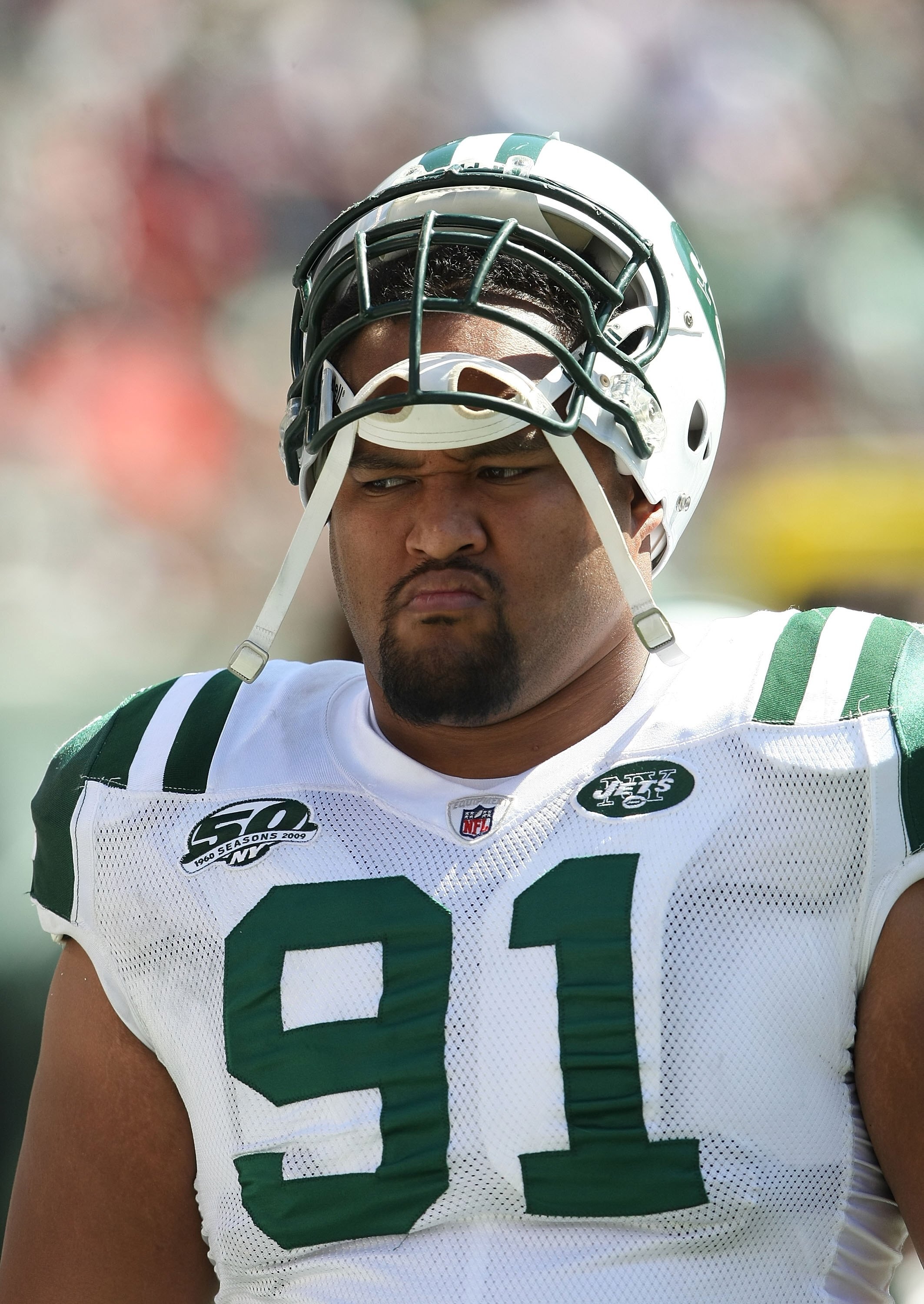 EAST RUTHERFORD, NJ - SEPTEMBER 20:  Sione Pouha #91 of the New York Jets on the sideline against the New England Patriots at Giants Stadium on September 20, 2009 in East Rutherford, New Jersey.  (Photo by Nick Laham/Getty Images)