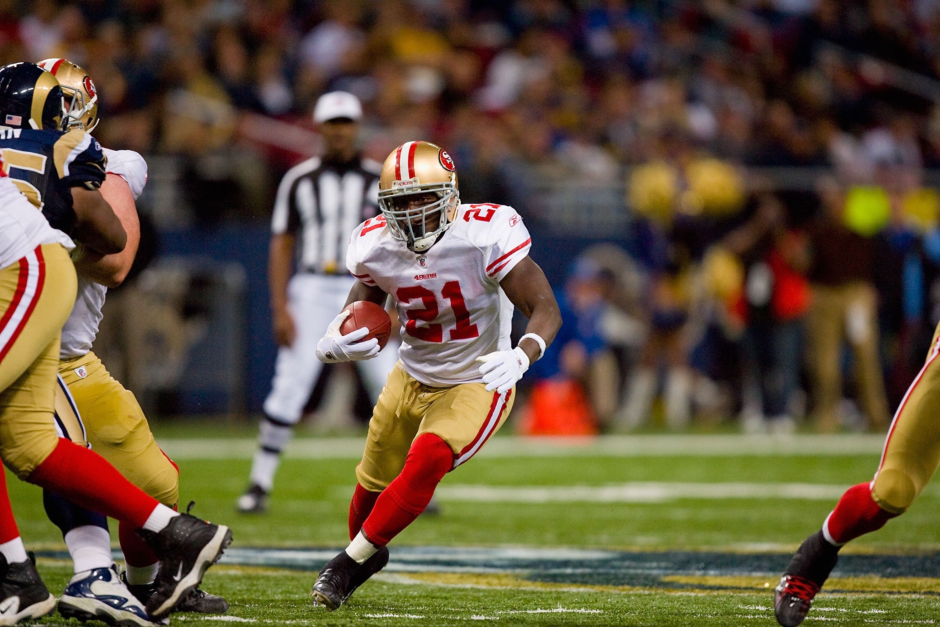 ST. LOUIS - JANUARY 3:  Frank Gore #21 of the San Francisco 49ers carries the ball during the game against the St. Louis Rams at the Edward Jones Dome on January 3, 2010 in St. Louis, Missouri.  The 49ers beat the Rams 28-6.  (Photo by Dilip Vishwanat/Get