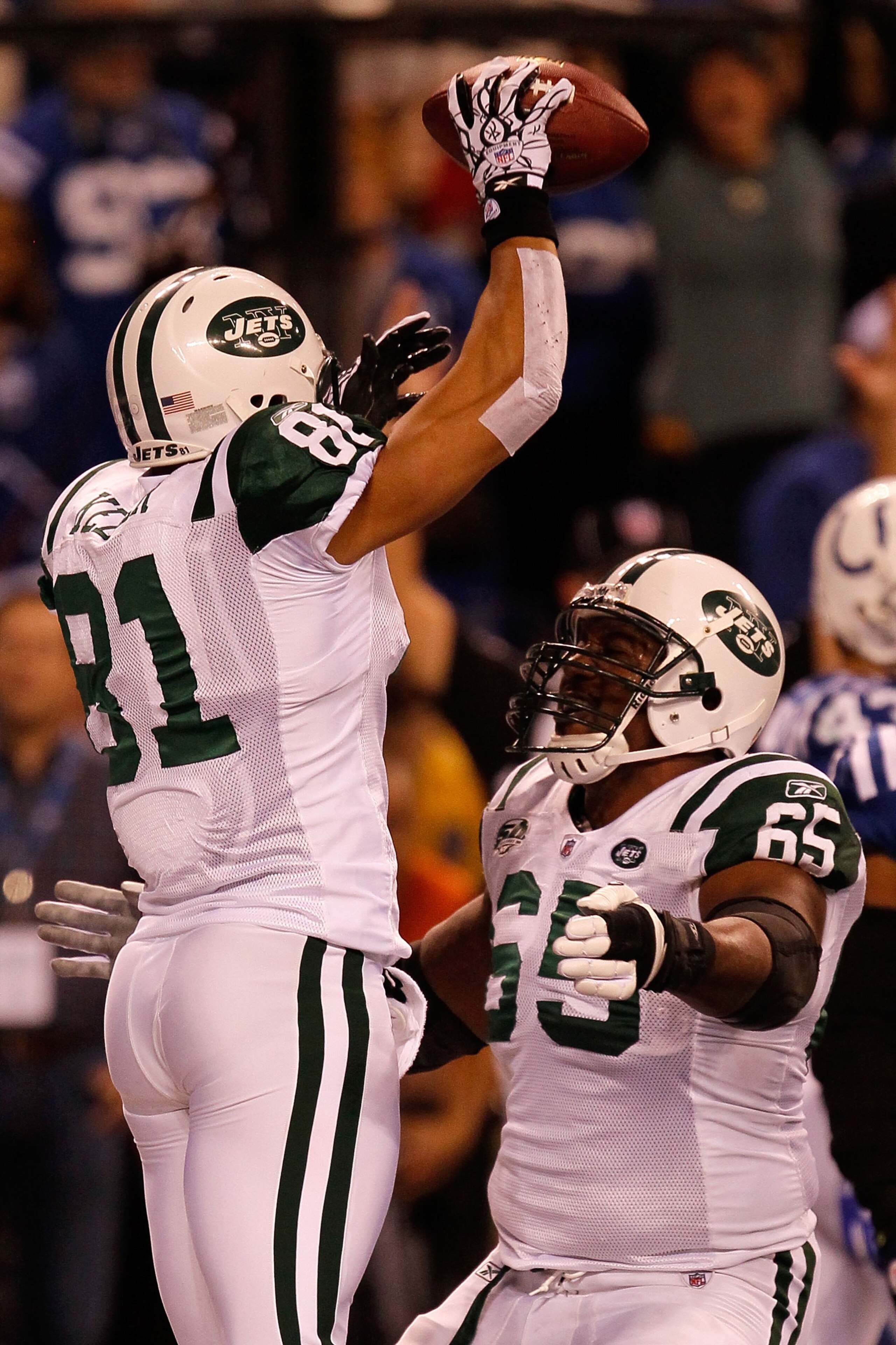 INDIANAPOLIS - JANUARY 24: Dustin Keller #81 of the New York Jets celebrates his touchdown in the second quarter with teammate Brandon Moore #65 while playing against the Indianapolis Colts during the AFC Championship Game at Lucas Oil Stadium on January INDIANAPOLIS - JANUARY 24: Dustin Keller #81 of the New York Jets celebrates his touchdown in the second quarter with teammate Brandon Moore #65 while playing against the Indianapolis Colts during the AFC Championship Game at Lucas Oil Stadium on January